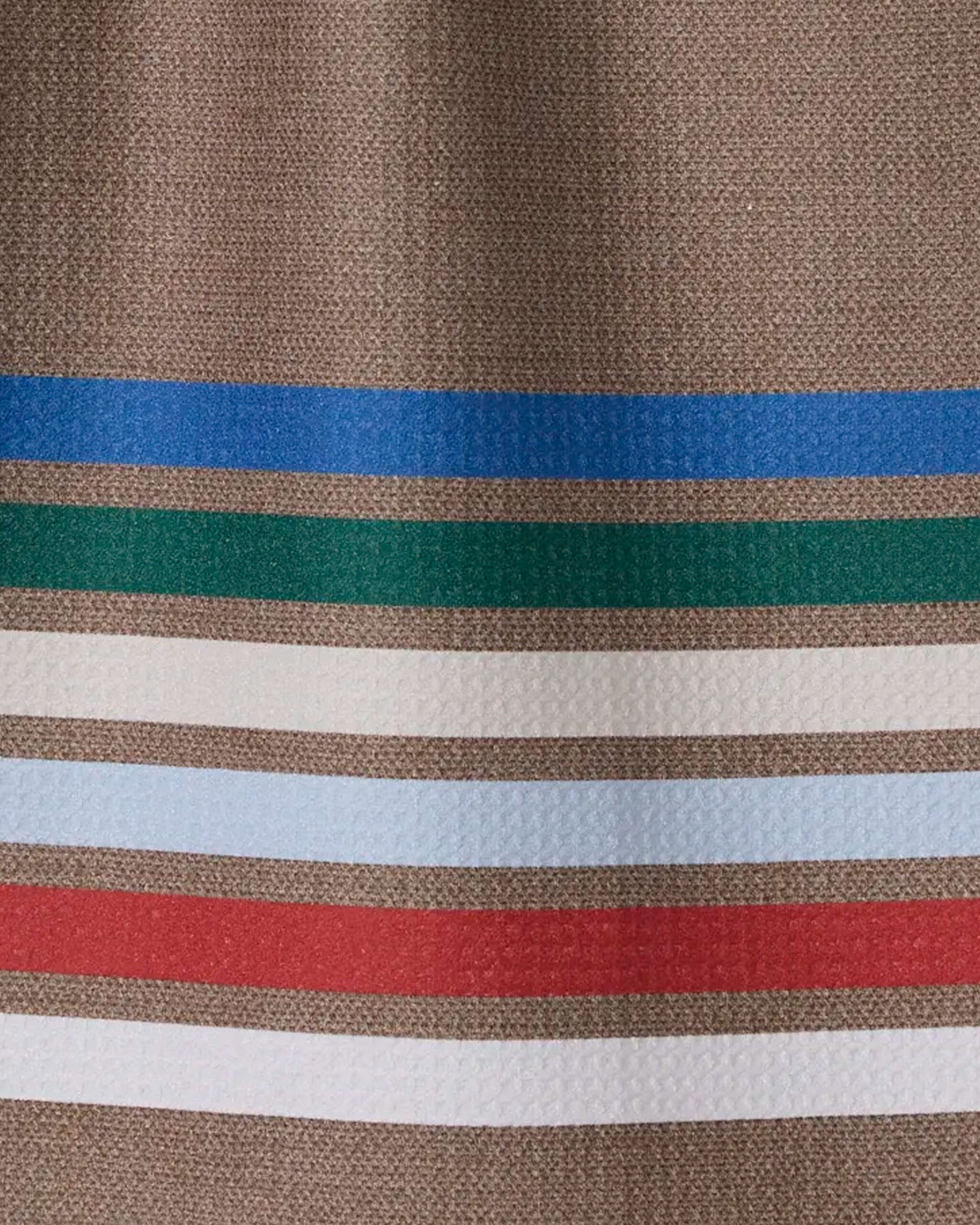 The Geometry Yuletide Band features a textured brown surface with blue, green, white, light blue, and red stripes—perfect as an absorbent dish towel for your kitchen.