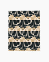 Letitia Dark by Amy MacCready features a repeating geometric pattern with black and beige fan-shaped designs on white in horizontal rows. Made from eco-friendly materials, it beautifully blends style with sustainability.