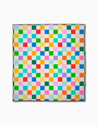 The Dance Floor quilt by Vaishali Design Studio features small, evenly sized bright squares in a grid on white. Crafted from quick-drying materials, it’s perfect as a beach blanket.