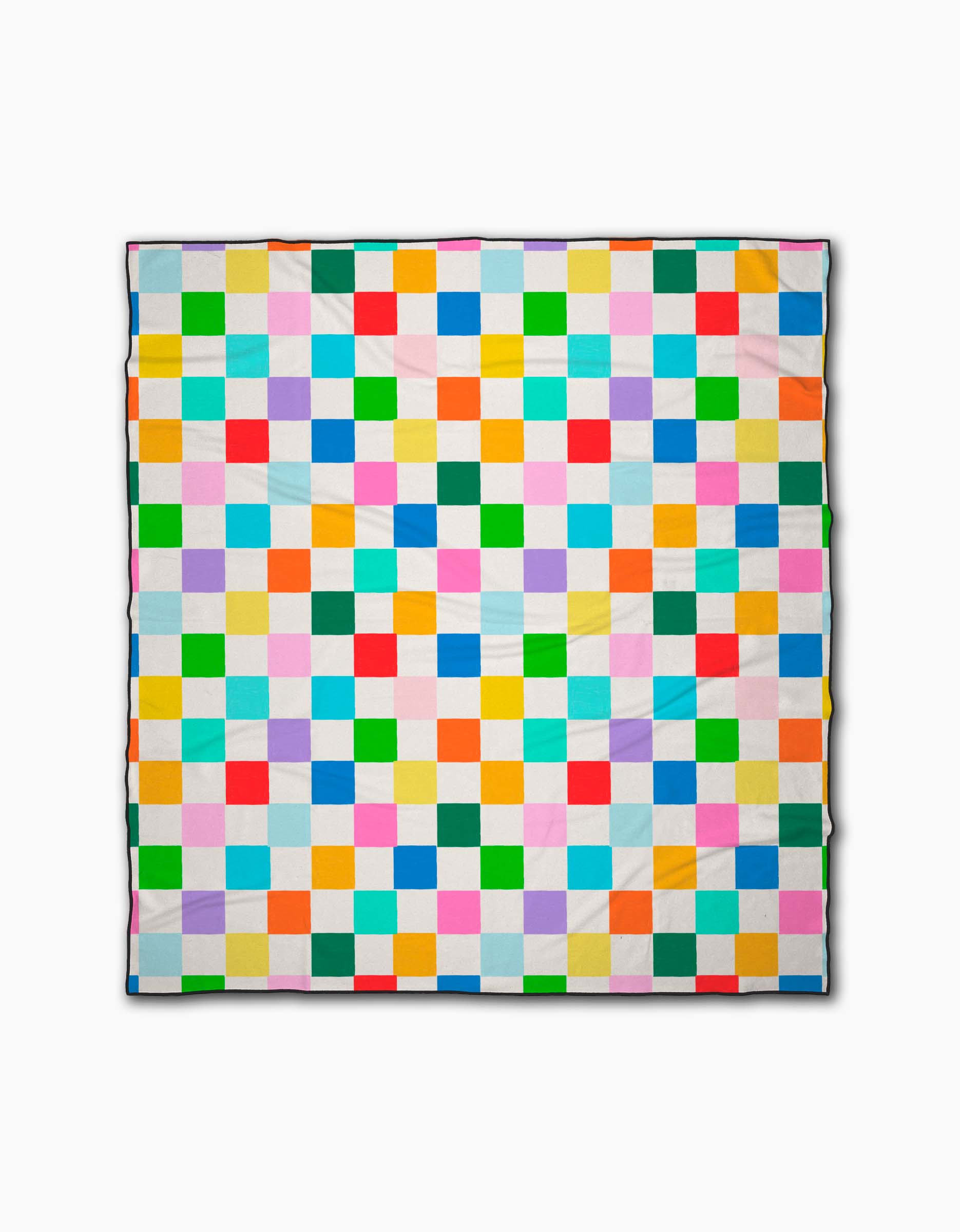 The Dance Floor quilt by Vaishali Design Studio features small, evenly sized bright squares in a grid on white. Crafted from quick-drying materials, it’s perfect as a beach blanket.