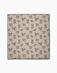 Forest Animals by Rosa Kichline is a beige recycled beach blanket with cute cartoon-style faces of bears, moose, rabbits, and birds in dark brown outlines—perfect for outdoor adventures and eco-conscious comfort.