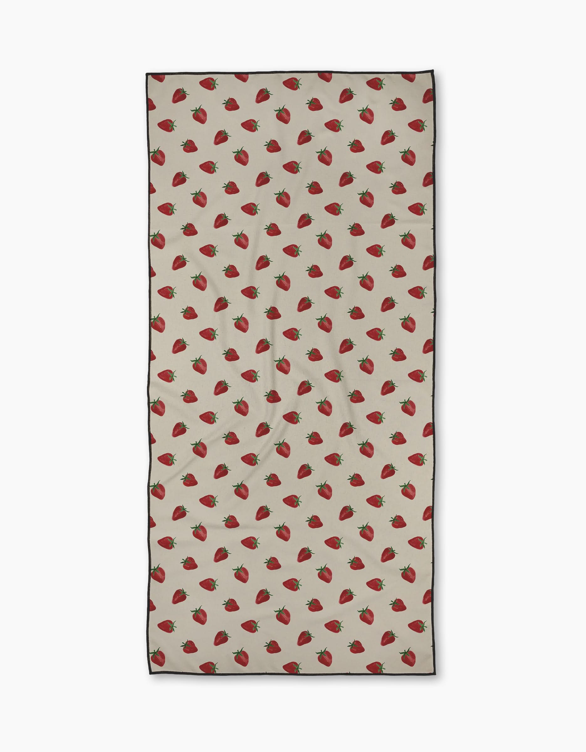 The Geometry Berry Patch towel is a beige rectangular quick-drying towel with a repeating pattern of evenly spaced red strawberries and green leaves across the surface.