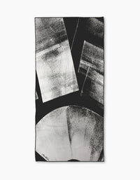 Abstract black and white artwork with geometric shapes—rectangles and a large partial circle—plus textured, brush-like patterns reminiscent of Skye Walker’s Black Graphite Shift.