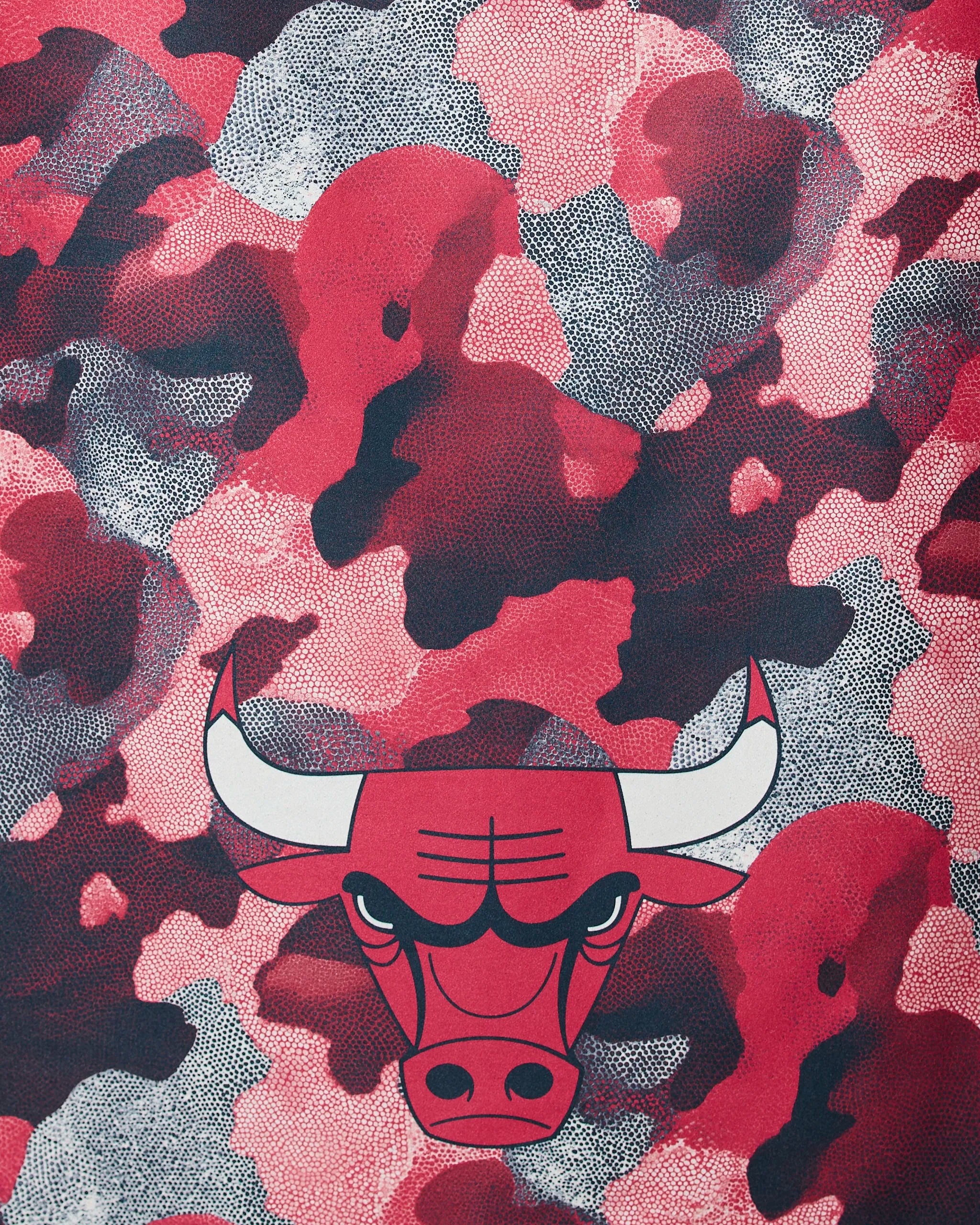 The Geometry Bulls Camo features the Chicago Bulls logo—a red bulls head with white horns and black tips—set against a bold red, black, and white camouflage background.