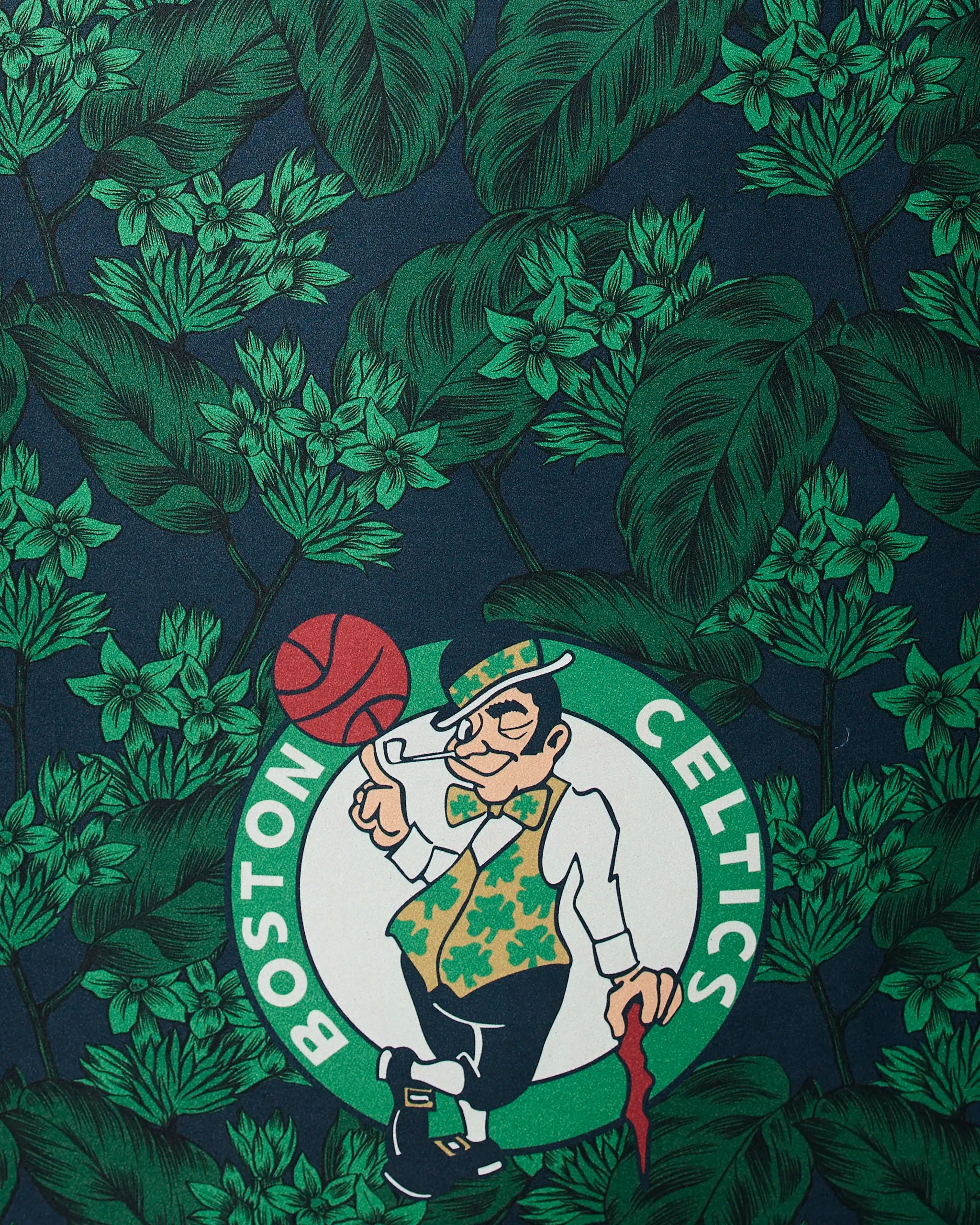 The Celtics Floral by Geometry features an illustration of the Boston Celtics logo with a leprechaun spinning a basketball, set against a backdrop of green leaves and foliage.