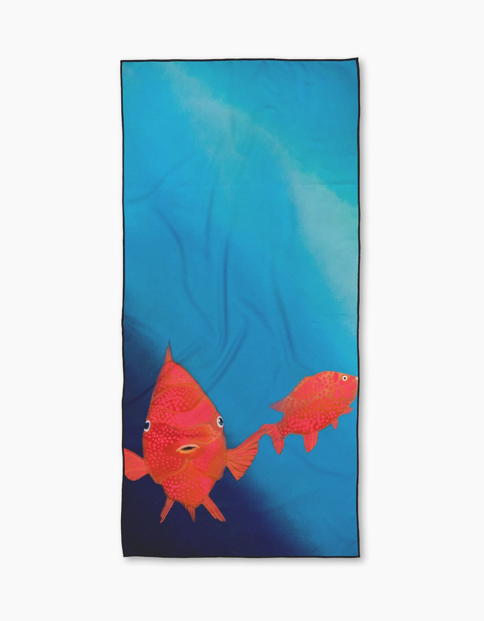 The Trey Jolley Coral Glow is a rectangular Geometry Micro-loop Beach Towel featuring two bright orange fish swimming on a gradient blue background, with the larger fish on the left and the smaller one on the right.
