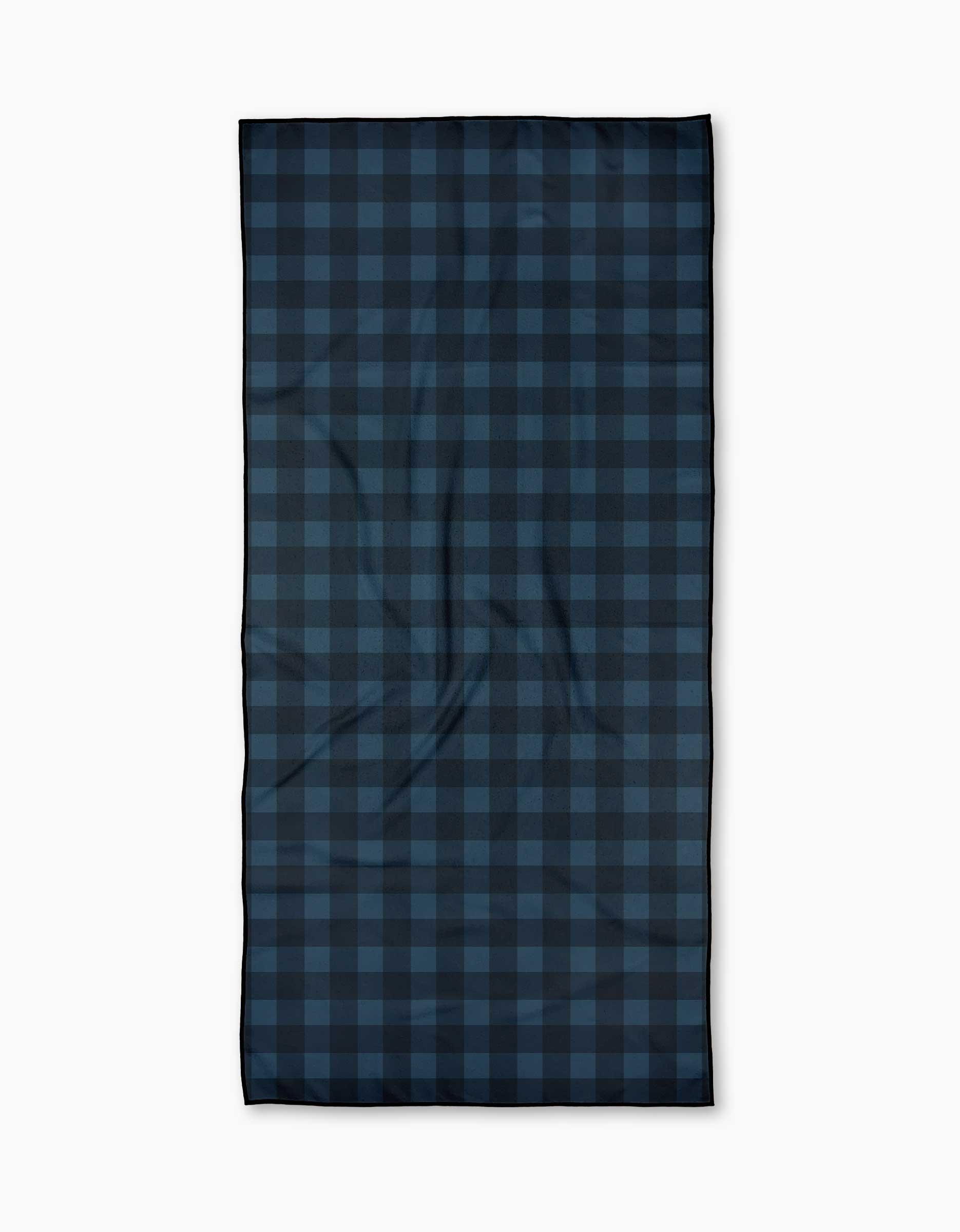 The Modern Dads Game Day is a rectangular beach towel with a dark blue and black checkered pattern, made from recycled materials. Laid flat on a white background, the fabric displays slight creases and folds.