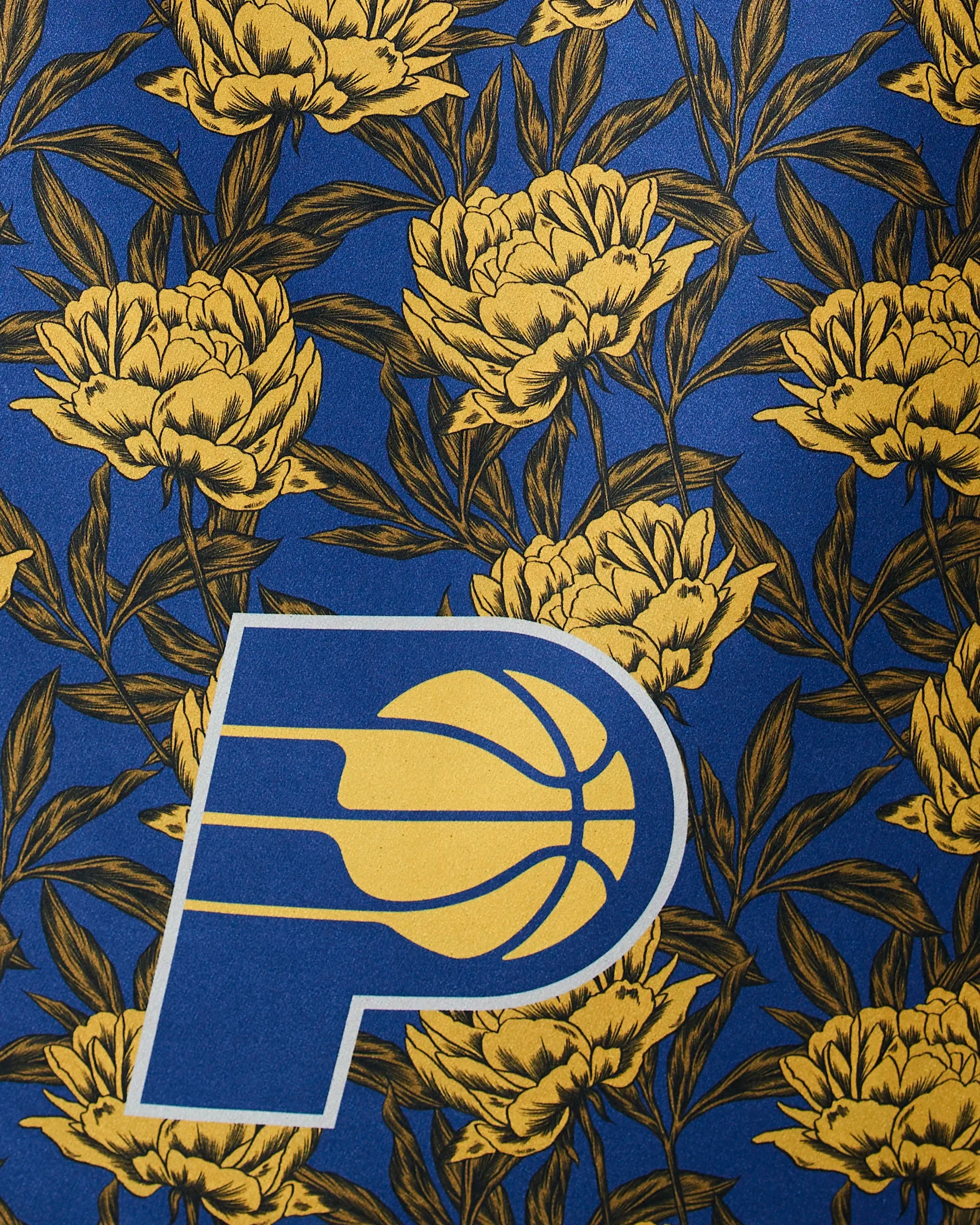 The image shows the Pacers Floral by Geometry, featuring the Indiana Pacers logo on a blue background with yellow flowers and dark green leaves.