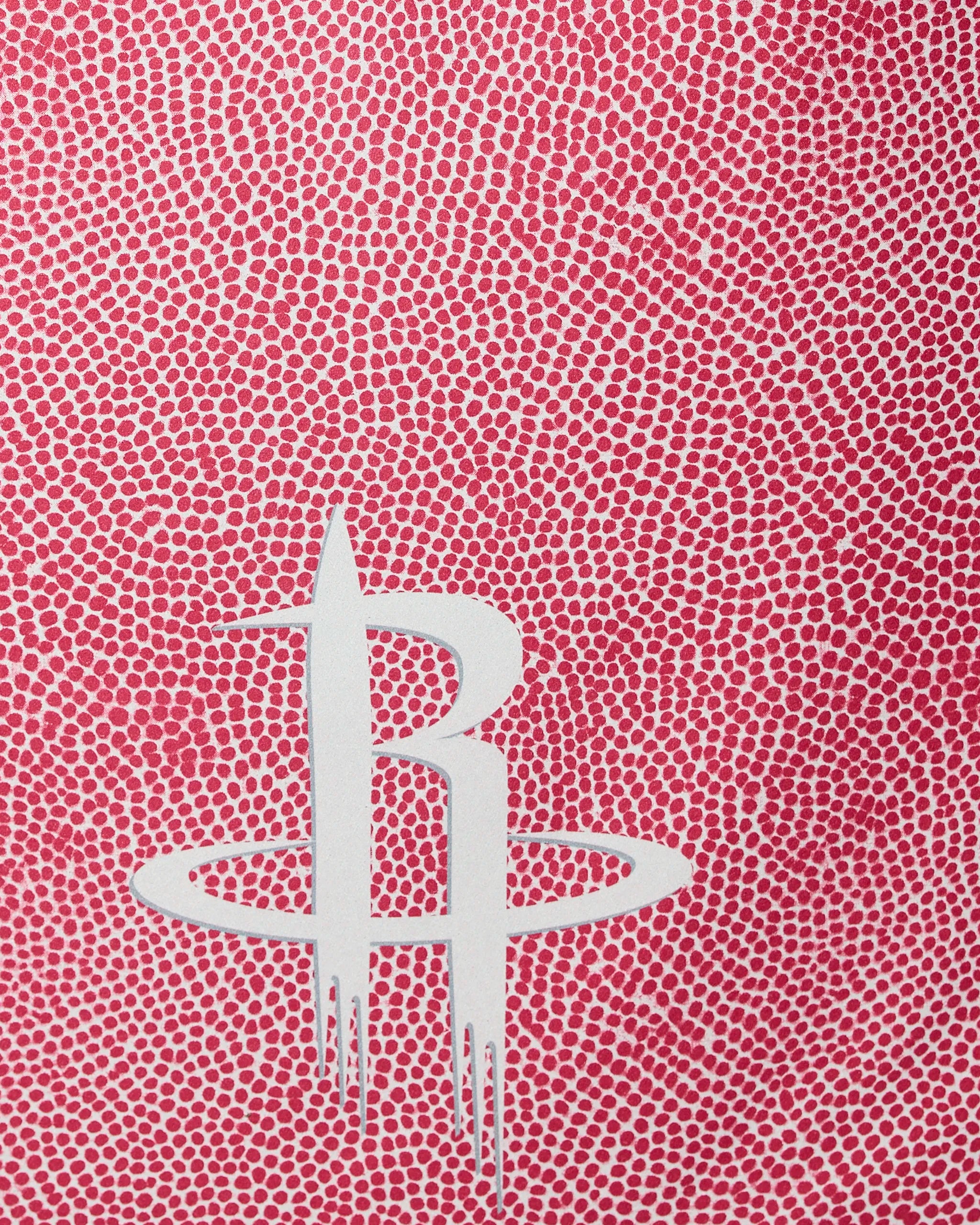 The Geometry Rockets Grip features a white Houston Rockets logo at the center, set against a background of dense red dots with white gaps for a unique, textured look.