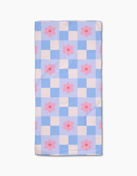The Blue Checkered Florals quilt by Letters By Shells features a blue and white checkered pattern with evenly spaced pink flowers, crafted from recycled materials for an eco-friendly design.