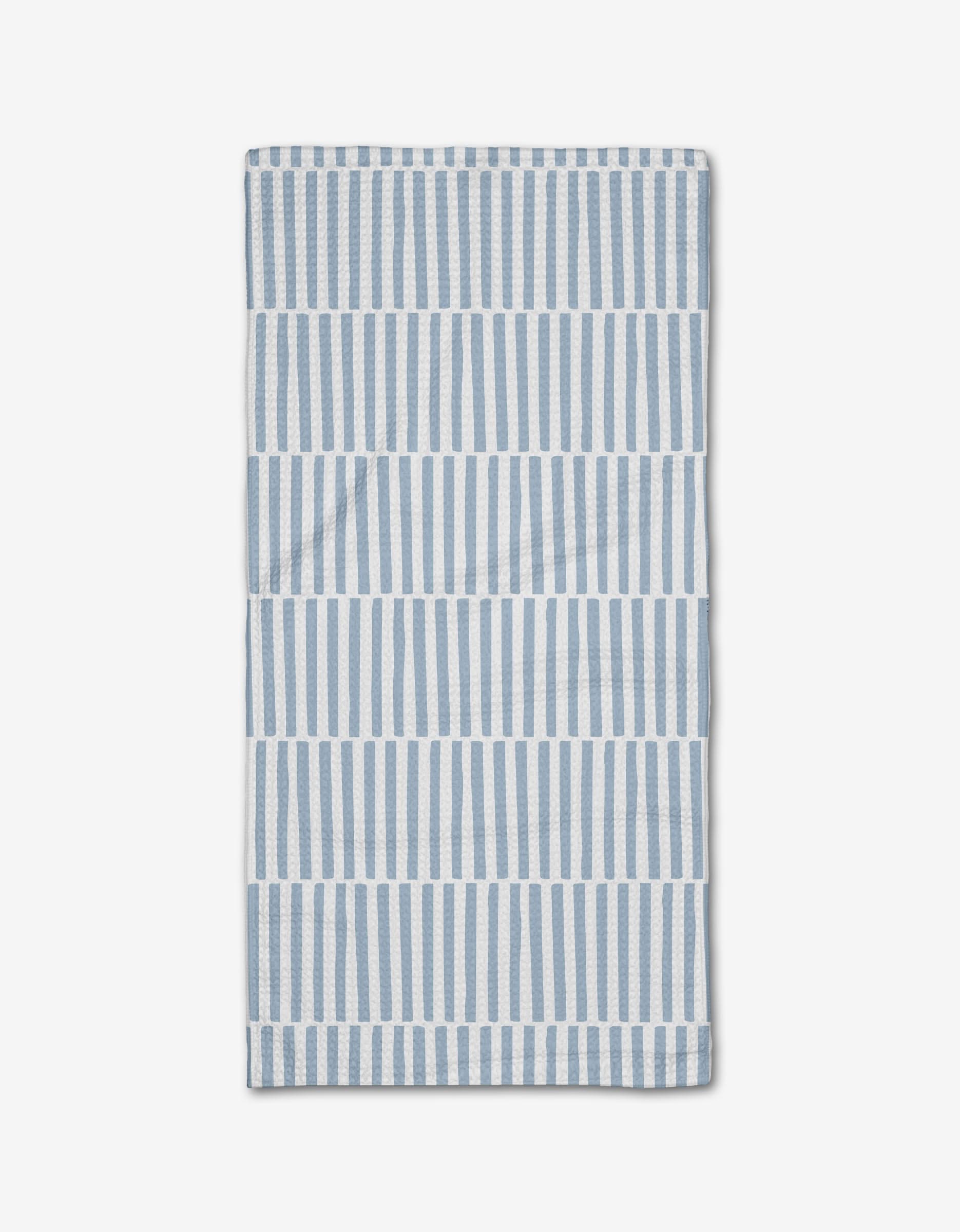 The Blue Stripes Bar Towel by Aubrey Fairchild features vertical blue and white stripes in horizontal bands on a white background, crafted from Geoweave fabric and neatly folded on a white surface.