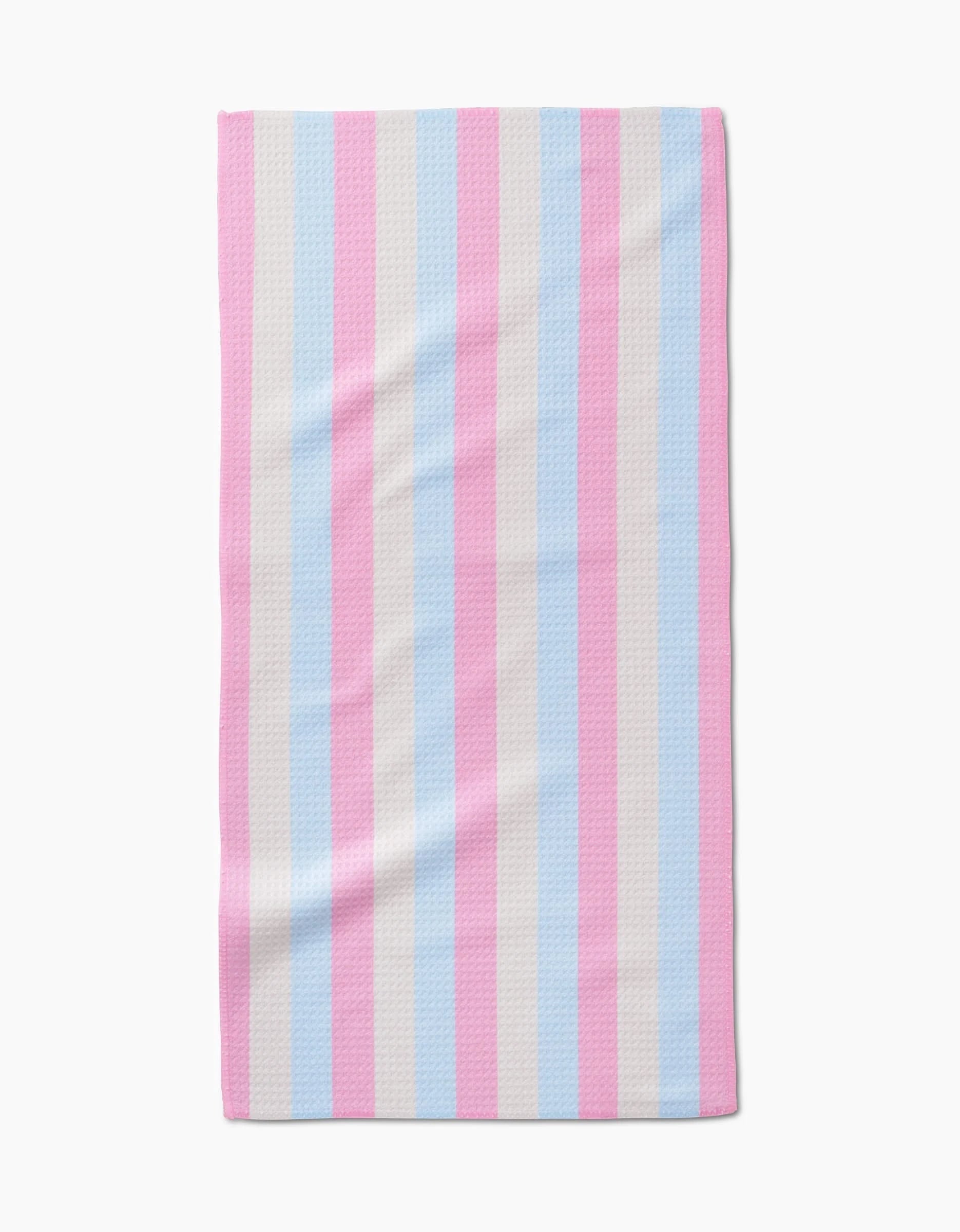 The Candy Pastels Bar Towel by Amy Droubay features vertical stripes in light blue, light pink, and white, inspired by the transgender pride flag, and is made from ultra-absorbent Geoweave fabric. Shown on a white background.