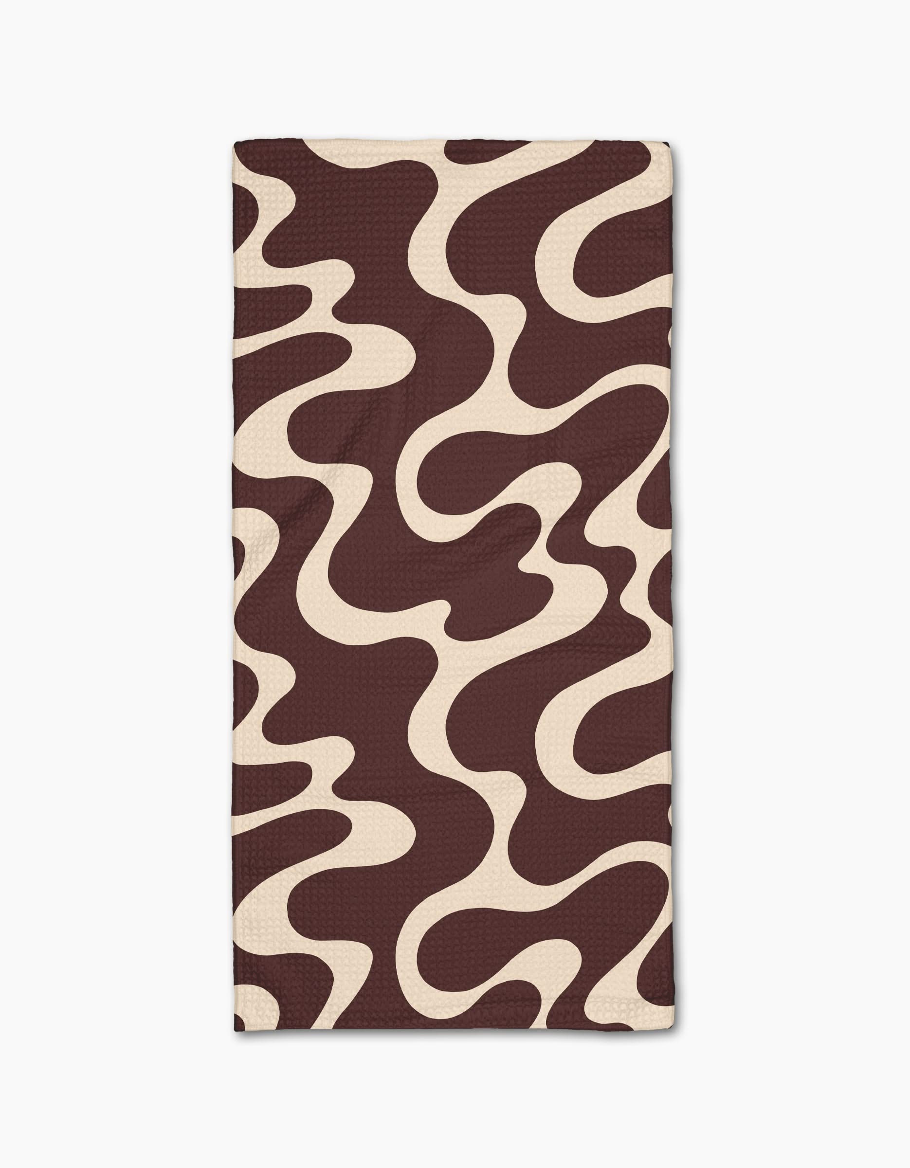 The Gerdadzy Chocolate Swirl towel is a rectangular, ultra-absorbent piece made from recycled materials, featuring an abstract dark brown and beige wavy pattern on white.