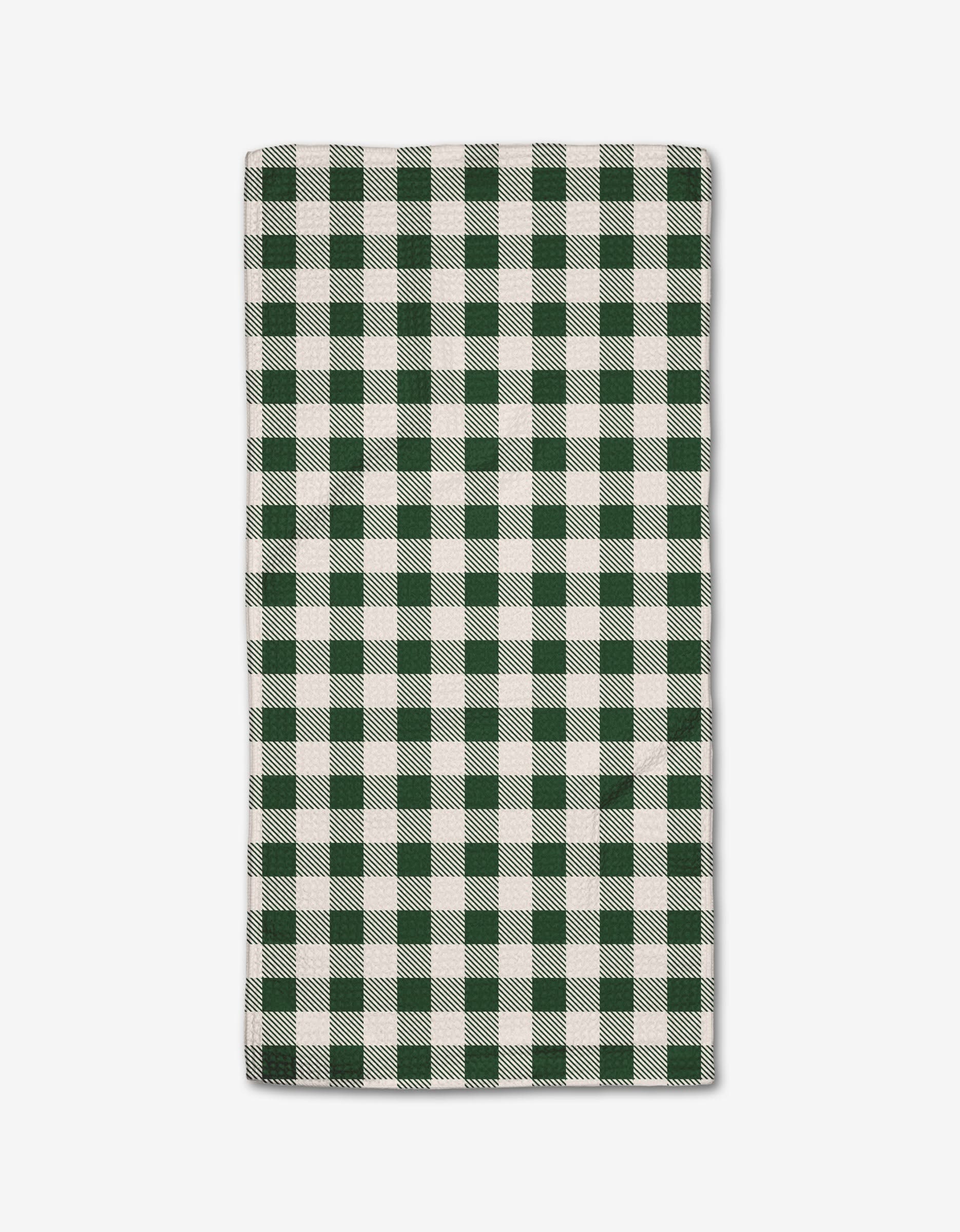 The Aubrey Fairchild Christmas Gingham Green napkin features a green and white checkered pattern, crafted from ultra-absorbent recycled materials and neatly folded for display on a white background.