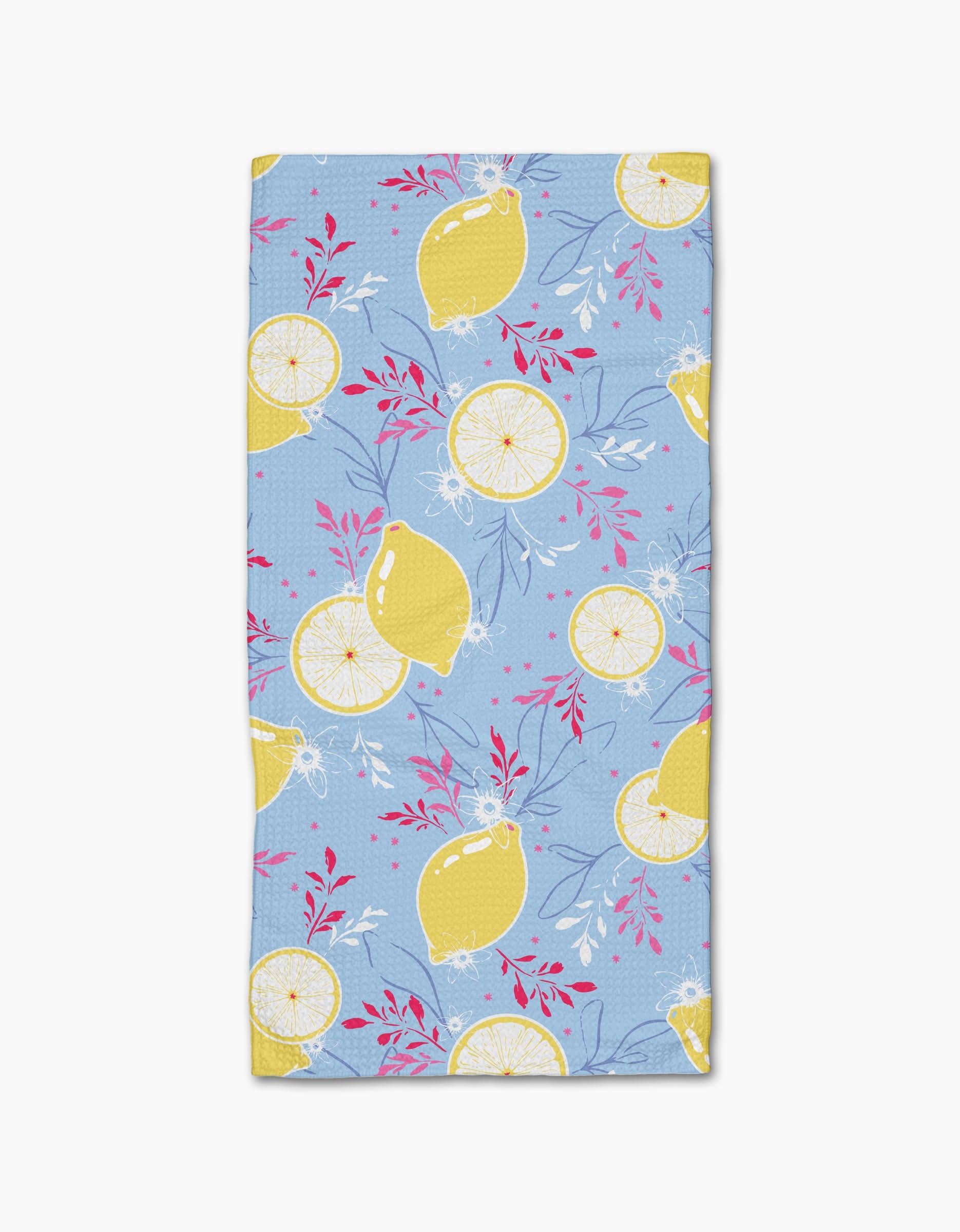The Citrus Bloom Bar Towel by Ashley Celena is made from recycled materials and features whole lemons, lemon slices, and pink leafy branches on a light blue background.
