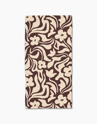 Floral Reverie by Gerdadzy is a beige rectangular cloth napkin with an abstract dark brown floral pattern of stylized flowers and wavy leaves, crafted from recycled materials for an eco-friendly touch.