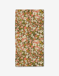 The Gilded Garden Bar Towel by Lisa Nelson features a floral pattern with pink, white, and orange flowers and green leaves on an olive background—your kitchen’s best friend.