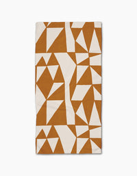 The Golden Angles bar towel by Lisa Nelson features an abstract geometric pattern of white and brown angular shapes in a modern, fragmented design on a white Geoweave fabric.