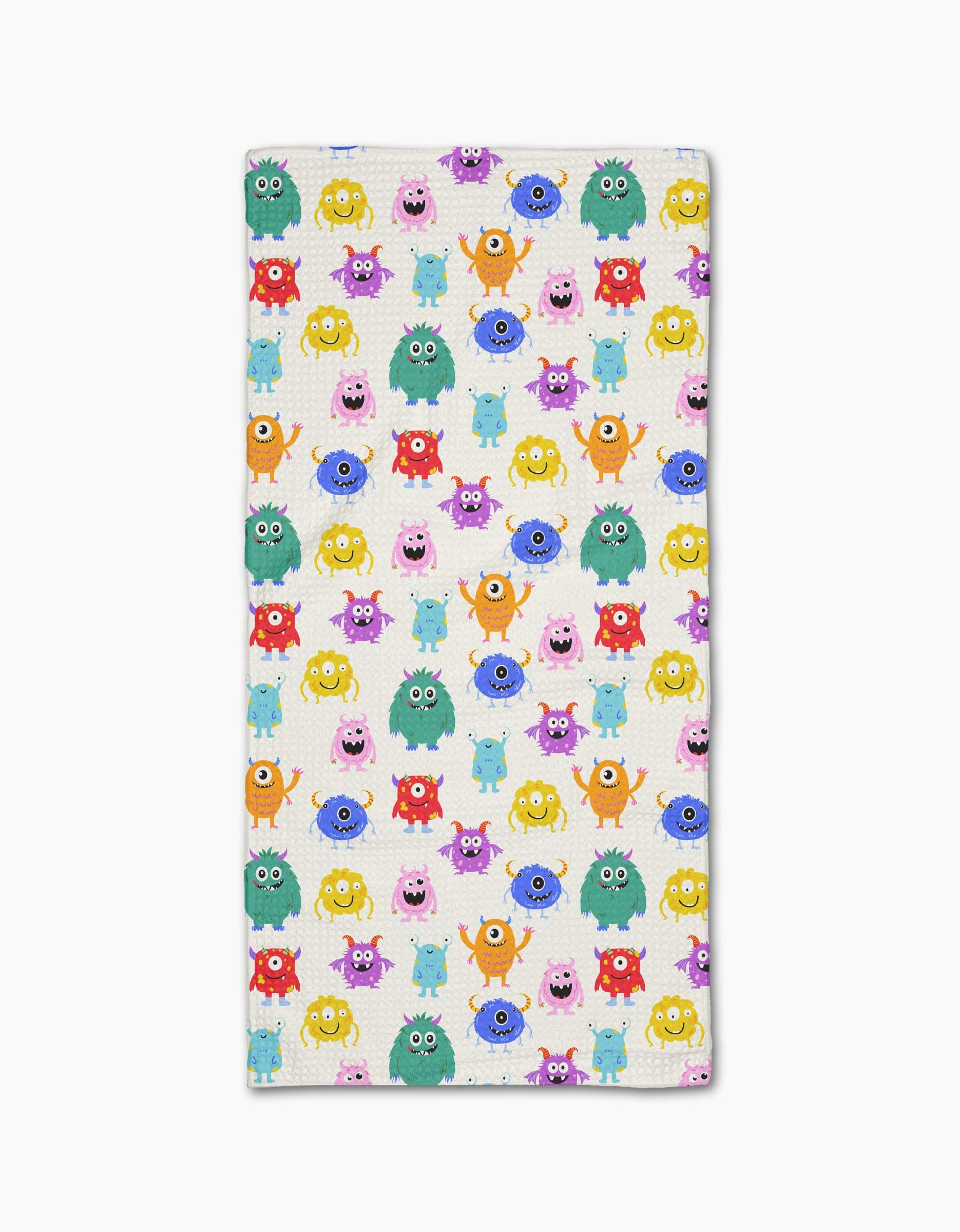 Goofy Critters Bar Towel by Vaishali Design Studio showcases colorful cartoon monsters on a white background, made from soft Geoweave fabric for extra absorbency.
