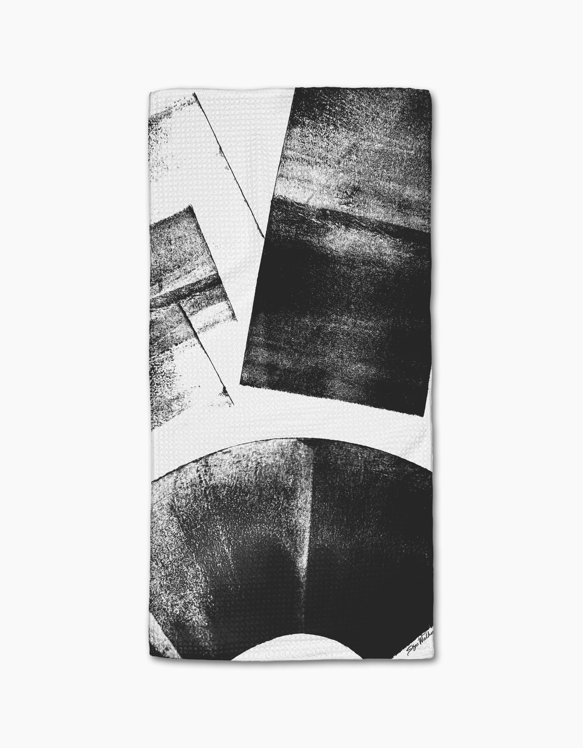 The Skye Walker Graphite Shift towel features a white ultra-absorbent fabric with bold black abstract geometric shapes for a modern, minimalist look.