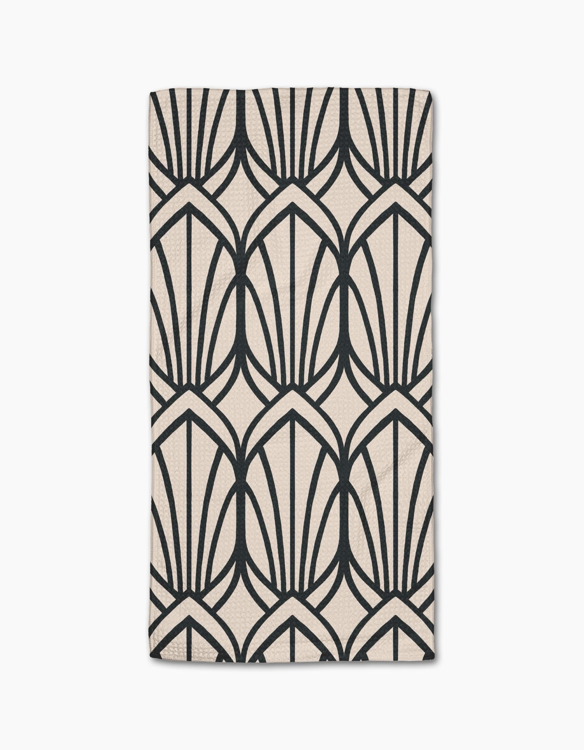 The Amy MacCready Jocelyn bar towel is beige, rectangular, made from Geoweave fabric, and features a bold black geometric pattern of stylized fan shapes or arches.