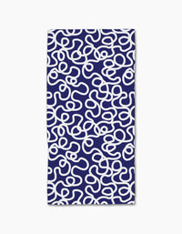 The Rachel Parker Mini Wander is a rectangular bar towel with a dark blue background and abstract white squiggle pattern, made from durable Geoweave fabric using post-consumer recycled materials.