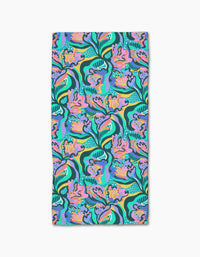 The Moody Flowers Bar Towel by Masha Volnova is rectangular, made from recycled materials, and features a colorful abstract floral pattern in pink, green, blue, yellow, and purple on a teal background.