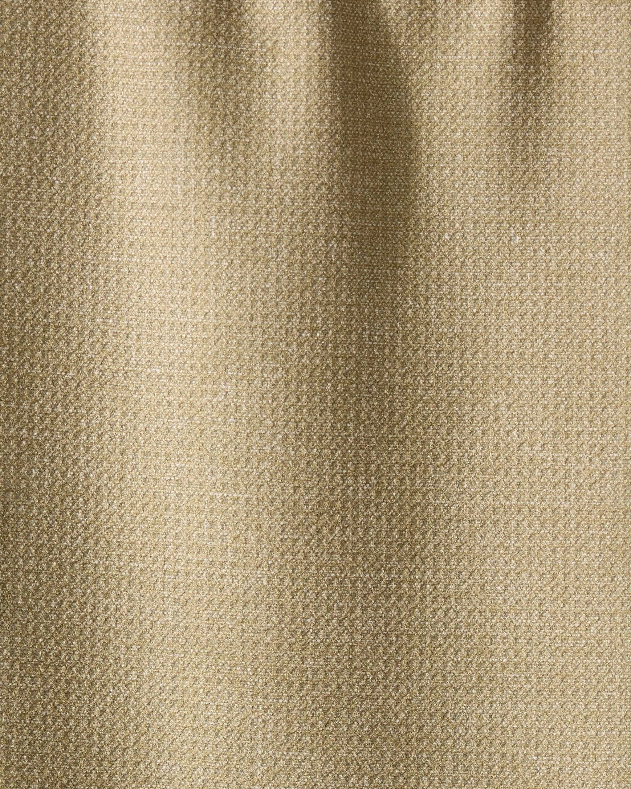 Close-up of Geometrys Mosswood towel in textured beige fabric, featuring a subtle weave pattern and soft vertical folds. The ultra-absorbent surface has a slight sheen, reflecting light gently.
