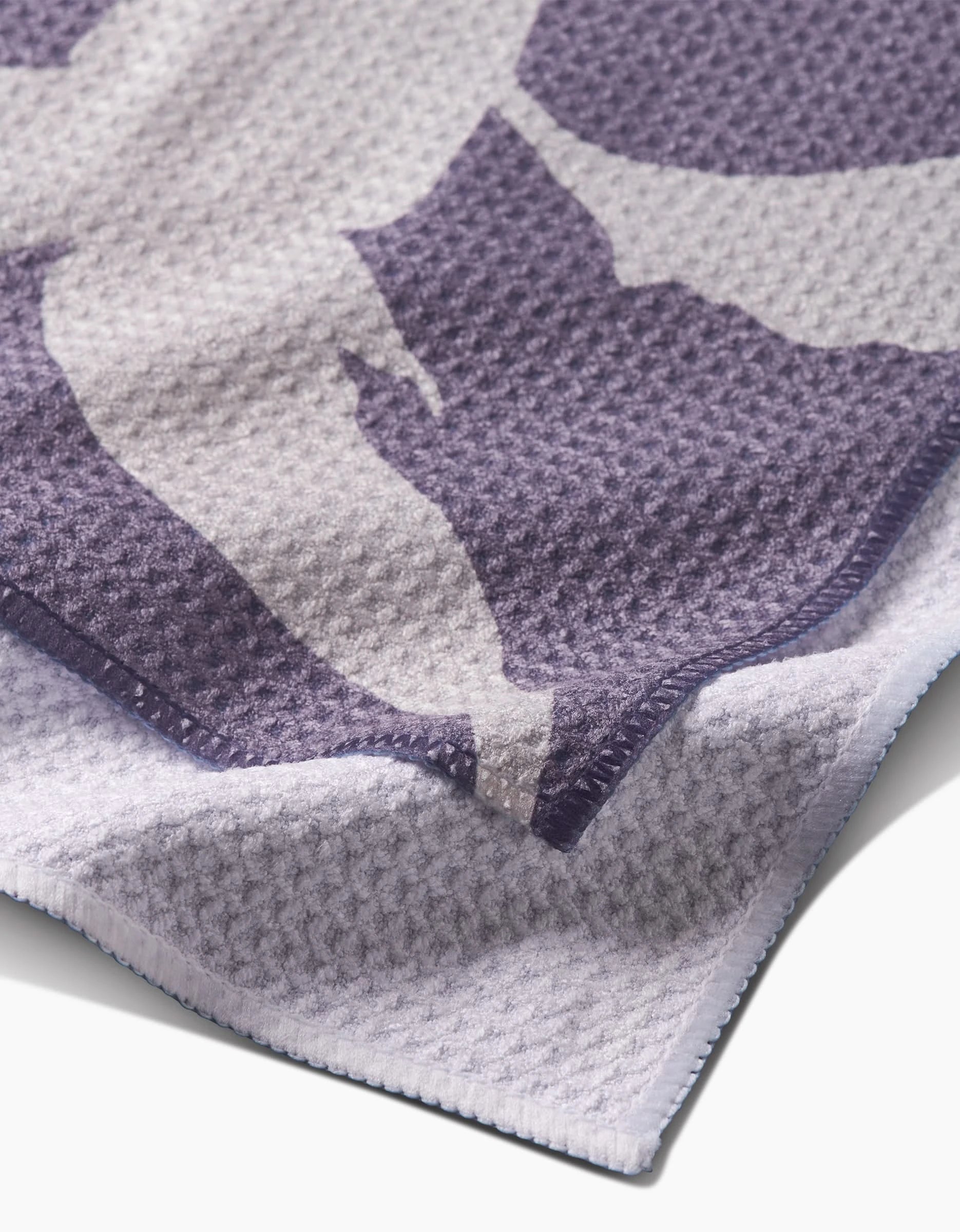 Close-up of the Pepper bar towel by PrintedPlant, featuring a textured purple and white waffle pattern, crafted from Geoweave fabric with neatly stitched edges and a soft, layered look.