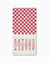 The Sardine Check by Hufton Studio is a white Geoweave bar towel with a red checkerboard on the top half and six red sardine fish lined up near the bottom.