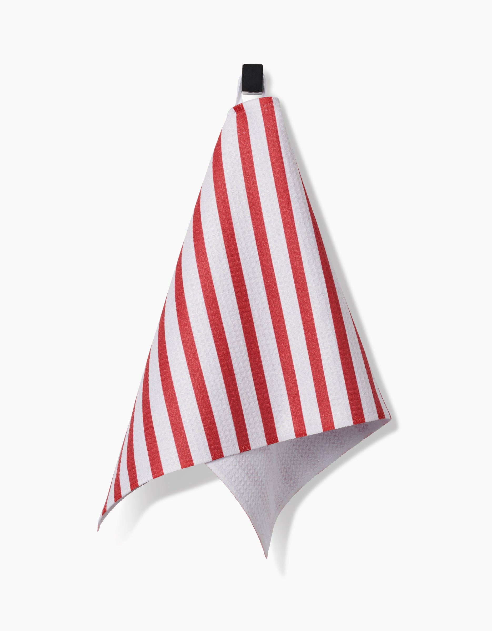 The Mindfulnice USA Stripes towel, featuring red and white stripes and made from Geoweave fabric, hangs by its black loop against a plain white background.