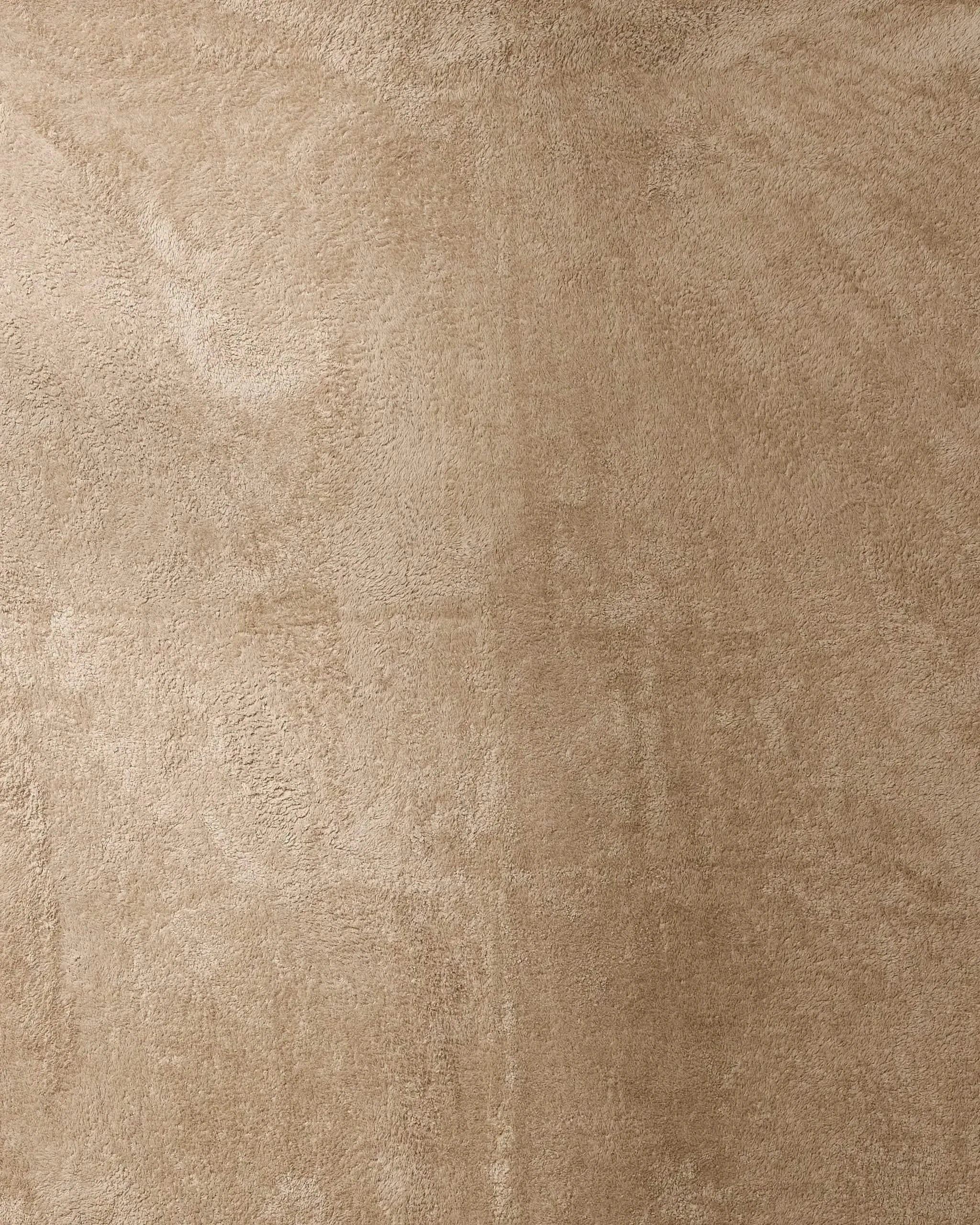 Close-up of the beige, soft-textured Happy Howleen dog towel from Geometry, featuring subtle shading and a faint vertical seam that highlights its plush, ultra-absorbent quality.