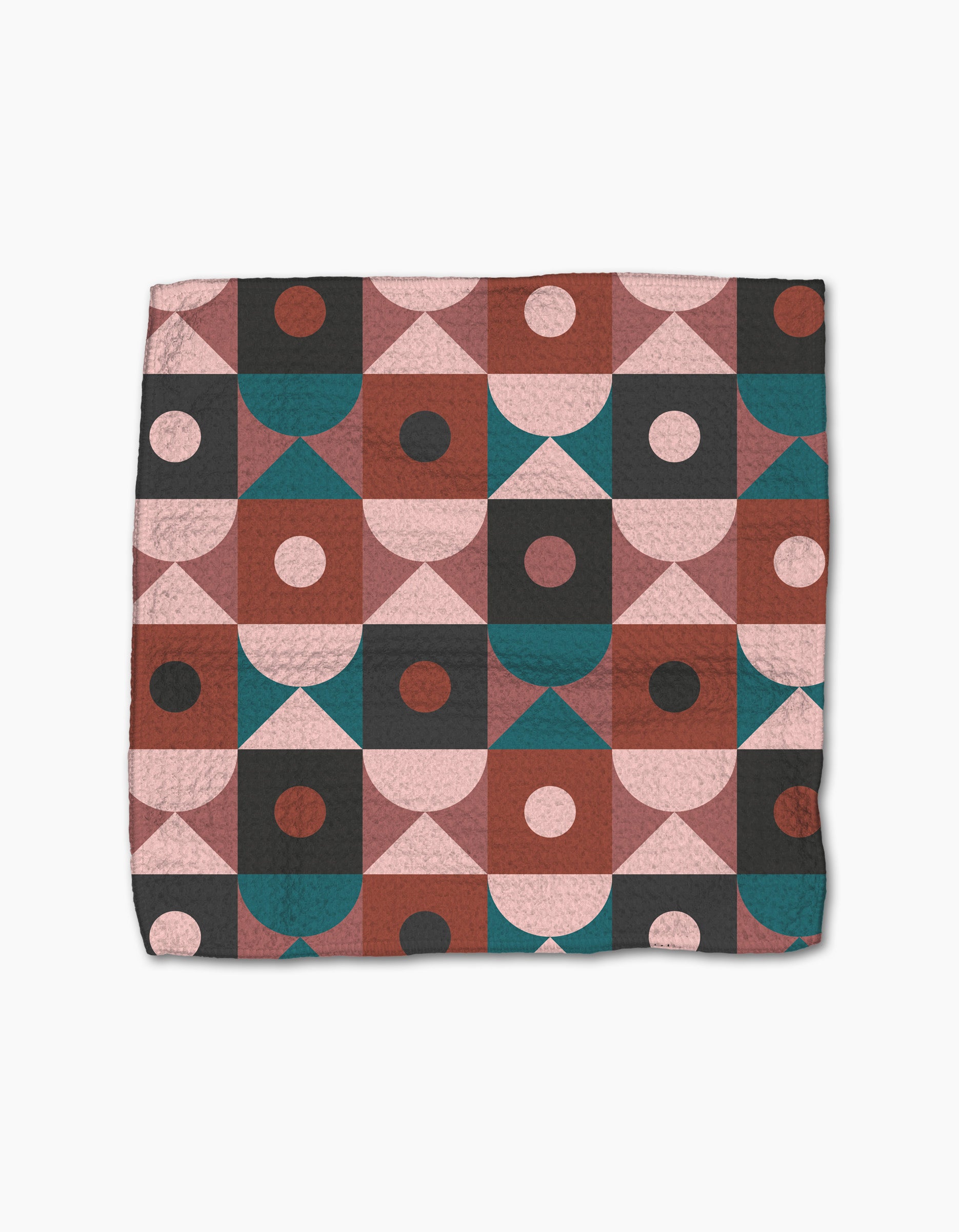 The Abstract Retro quilt by Jennifer Bouron showcases a geometric pattern in pink, burgundy, teal, and black on white, perfectly matching the super-absorbent dishcloth set for a modern kitchen.