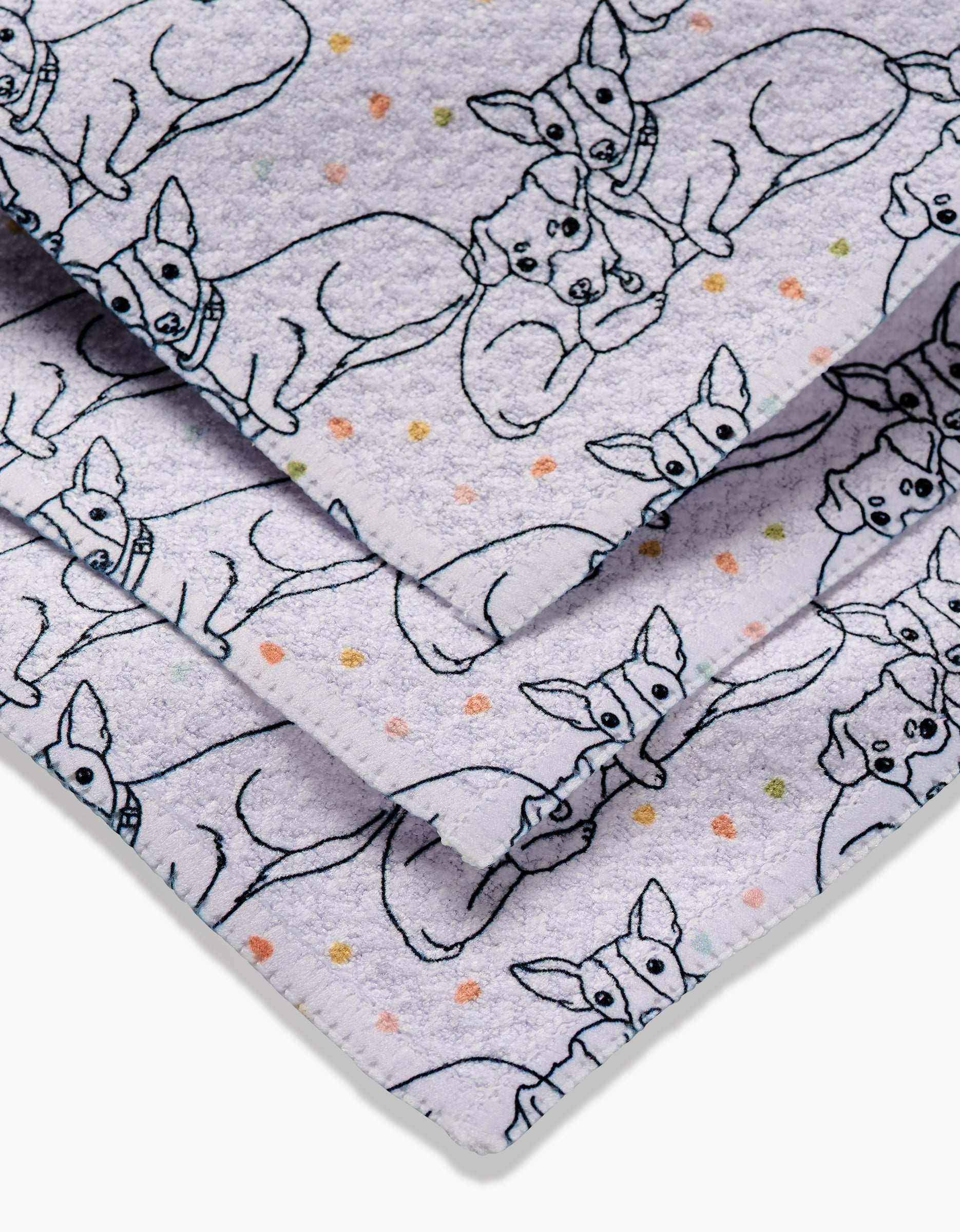 Close-up of Berry and Louie by Sweet Simple Vegan: soft Geoweave fabric with a repeating line-drawing pattern of small dogs in collars, plus pastel polka dots on white—ideal for dishcloths.