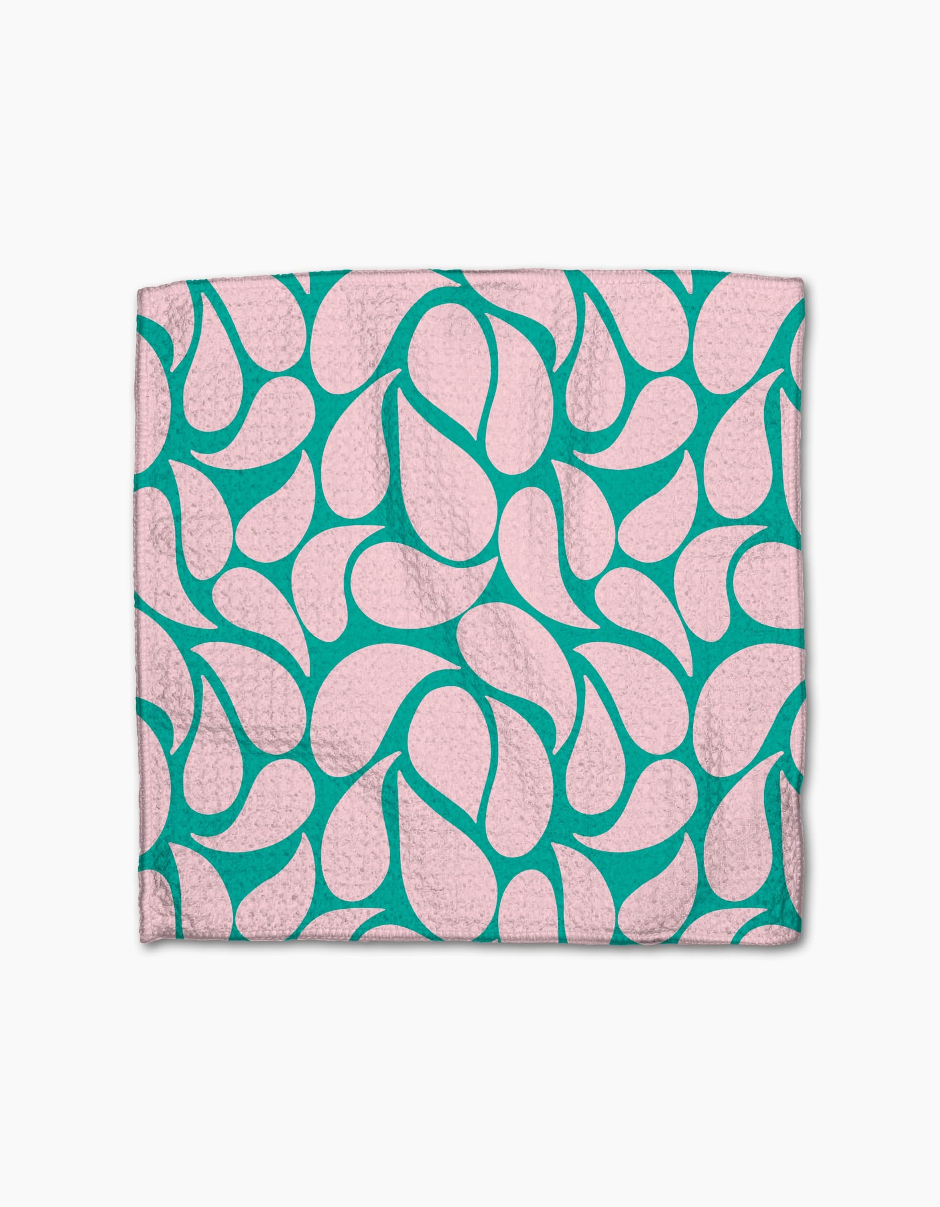 The Cheetah Haven dishcloth set by Jasmine Blooms Designs features folded pink cloths with a teal abstract, teardrop-like pattern, crafted from recycled materials and shown on a white background.