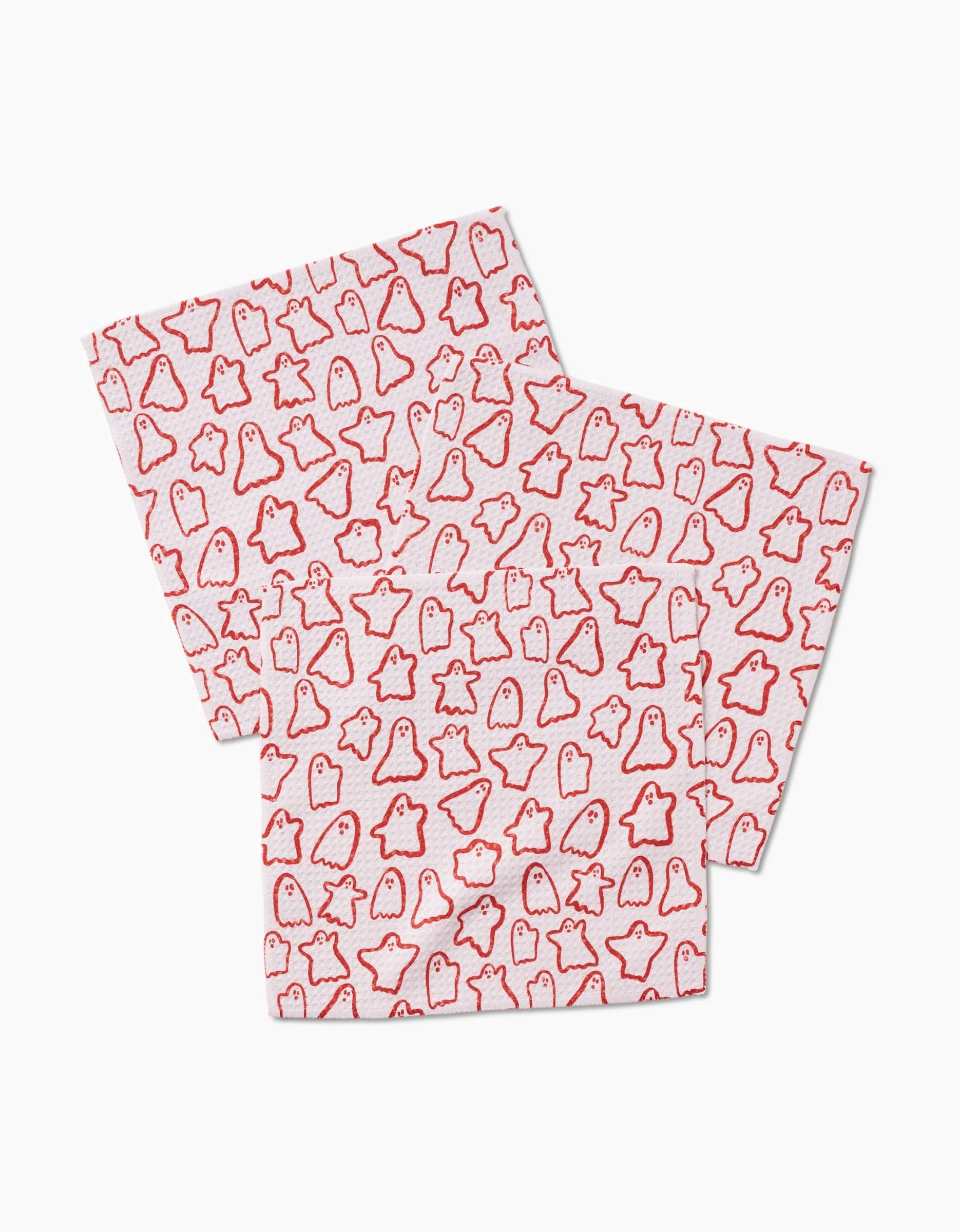 Kayla Ann’s Cute Ghosts set includes three white Geoweave napkins, each adorned with a playful pattern of small red ghost outlines, showcasing both unique design and quality craftsmanship.