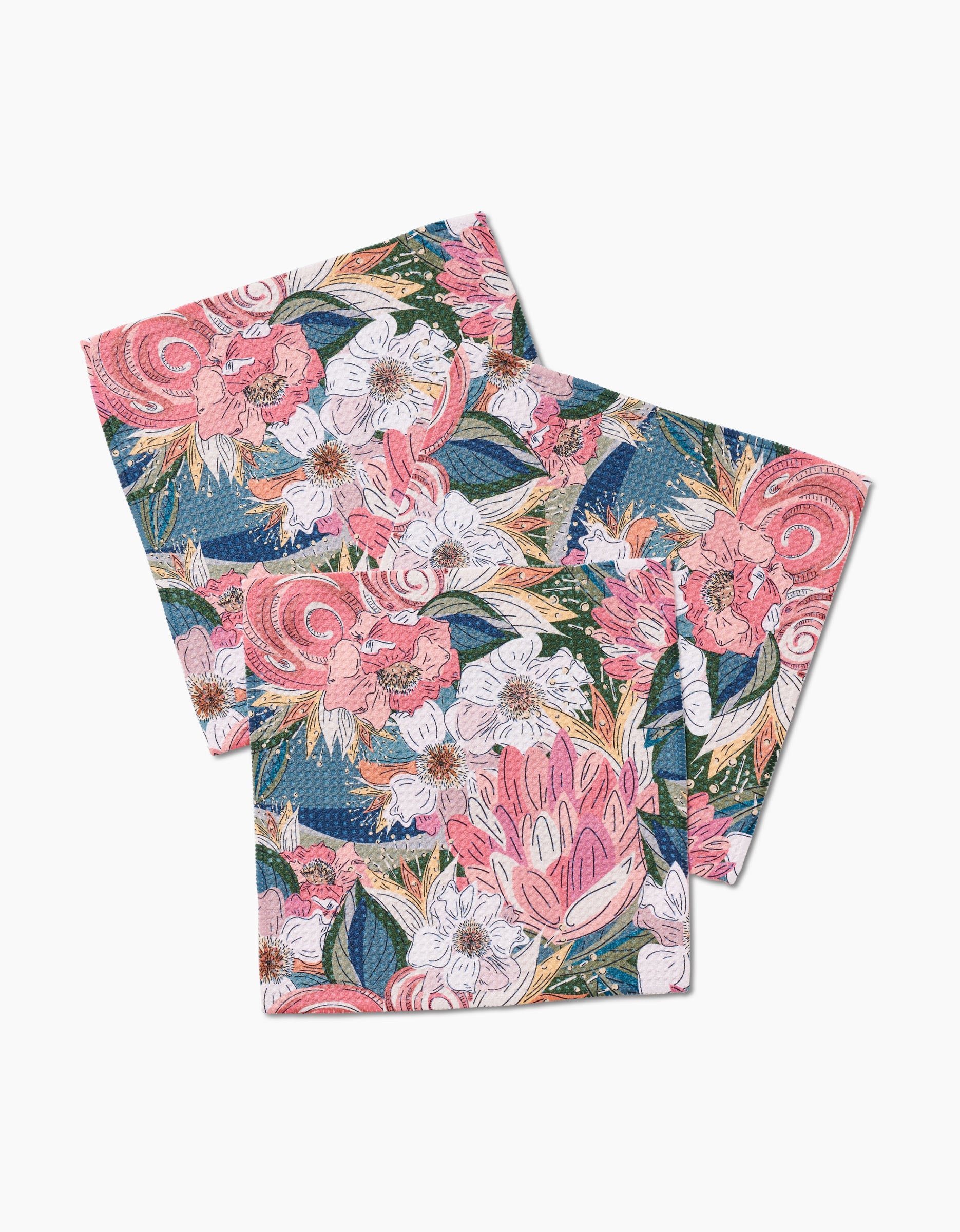 Two folded Flower Explosion cloth napkins by Second Nature Studio, featuring a vibrant floral pattern in pink, coral, white, green, and blue on white, crafted from soft recycled materials.