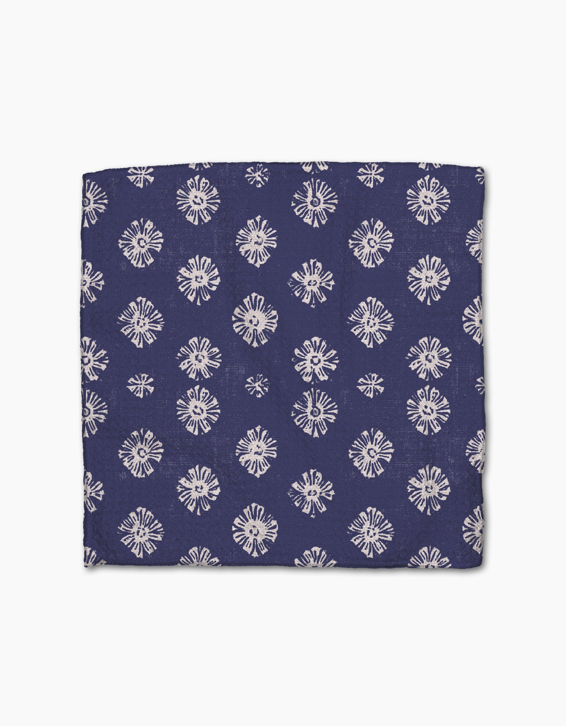 The Geometry Flowing Ocean dishtowel features a navy Geoweave fabric with repeating white starburst patterns, combining style and super absorbency for your kitchen.