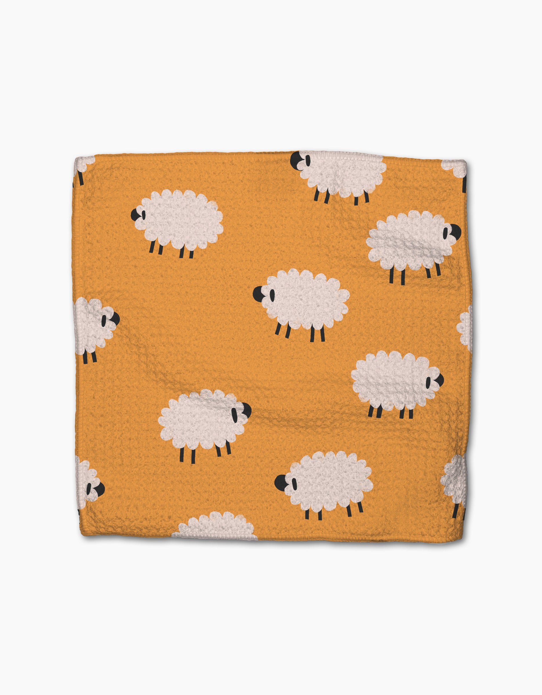 The Fluff and Feathers blanket by Jennifer Bouron is a soft orange throw made from recycled materials, decorated with white cartoon sheep with black faces and legs, shown on a plain white background.