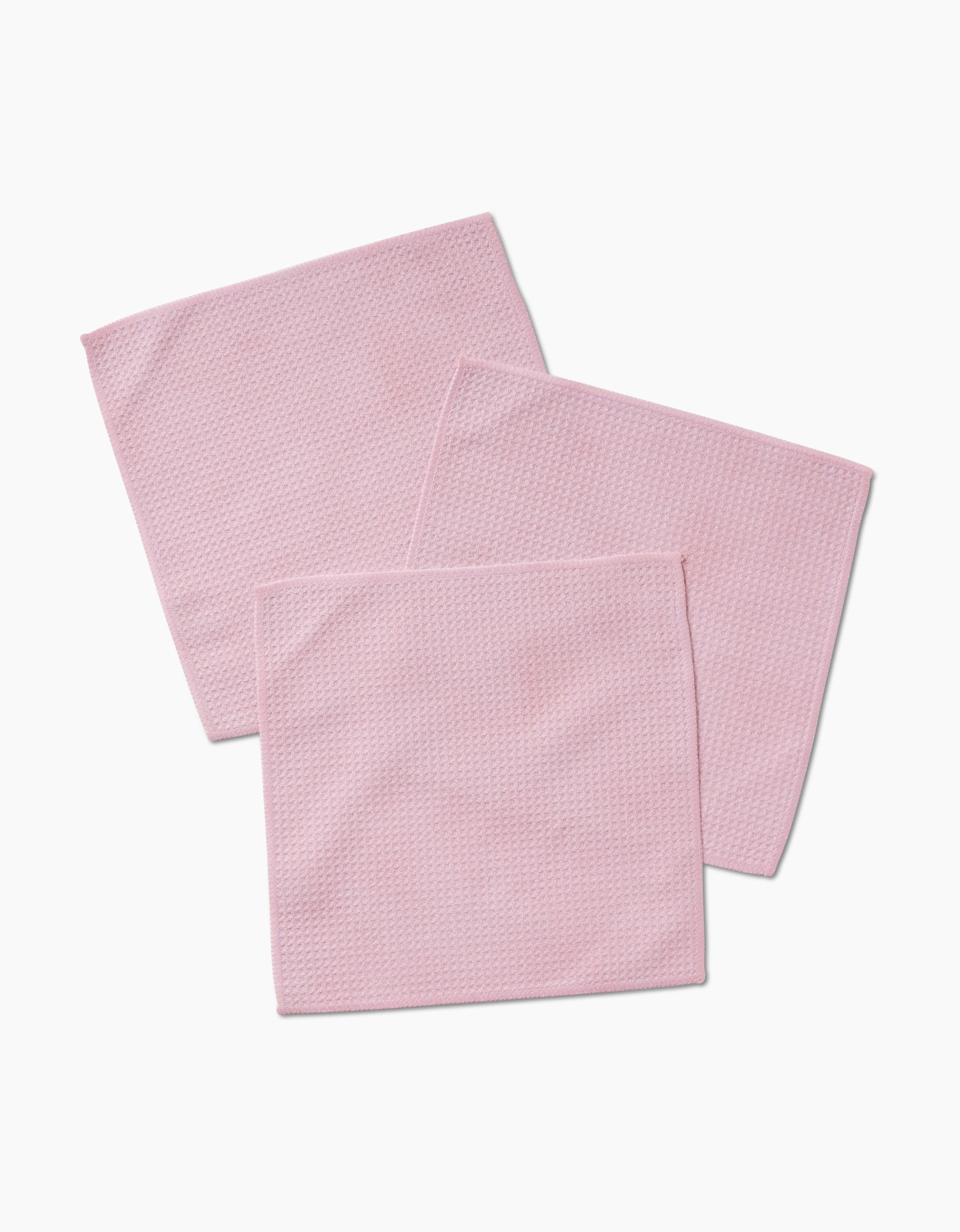 Three Harper Pink Geoweave fabric cloth squares, made from recycled materials, are arranged overlapping each other on a white background.