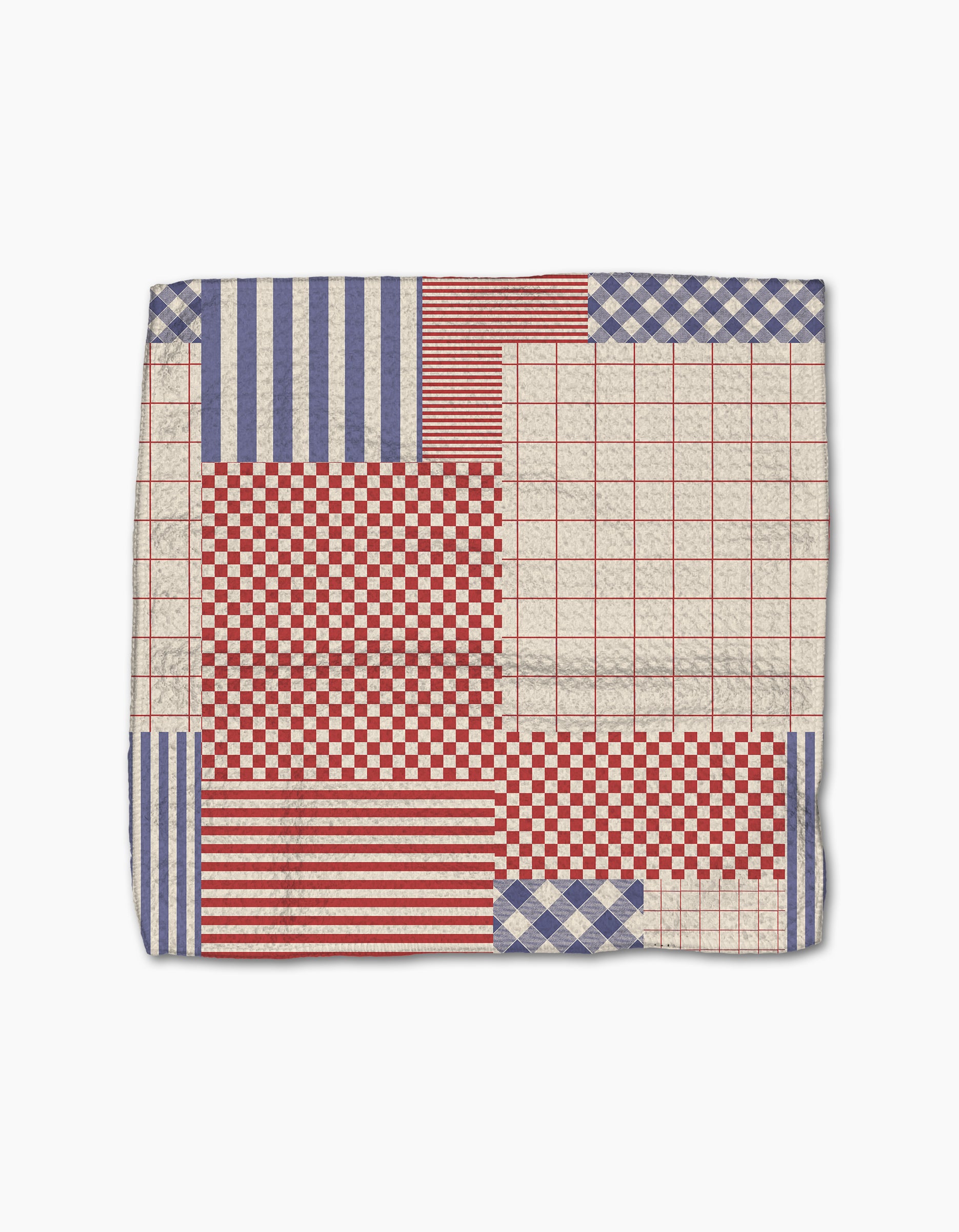 The Patched Up Parade by Geometry features a patchwork of red, white, and blue geometric patterns on a white background, inspired by classic dishcloths and made with super-absorbent, recycled materials.