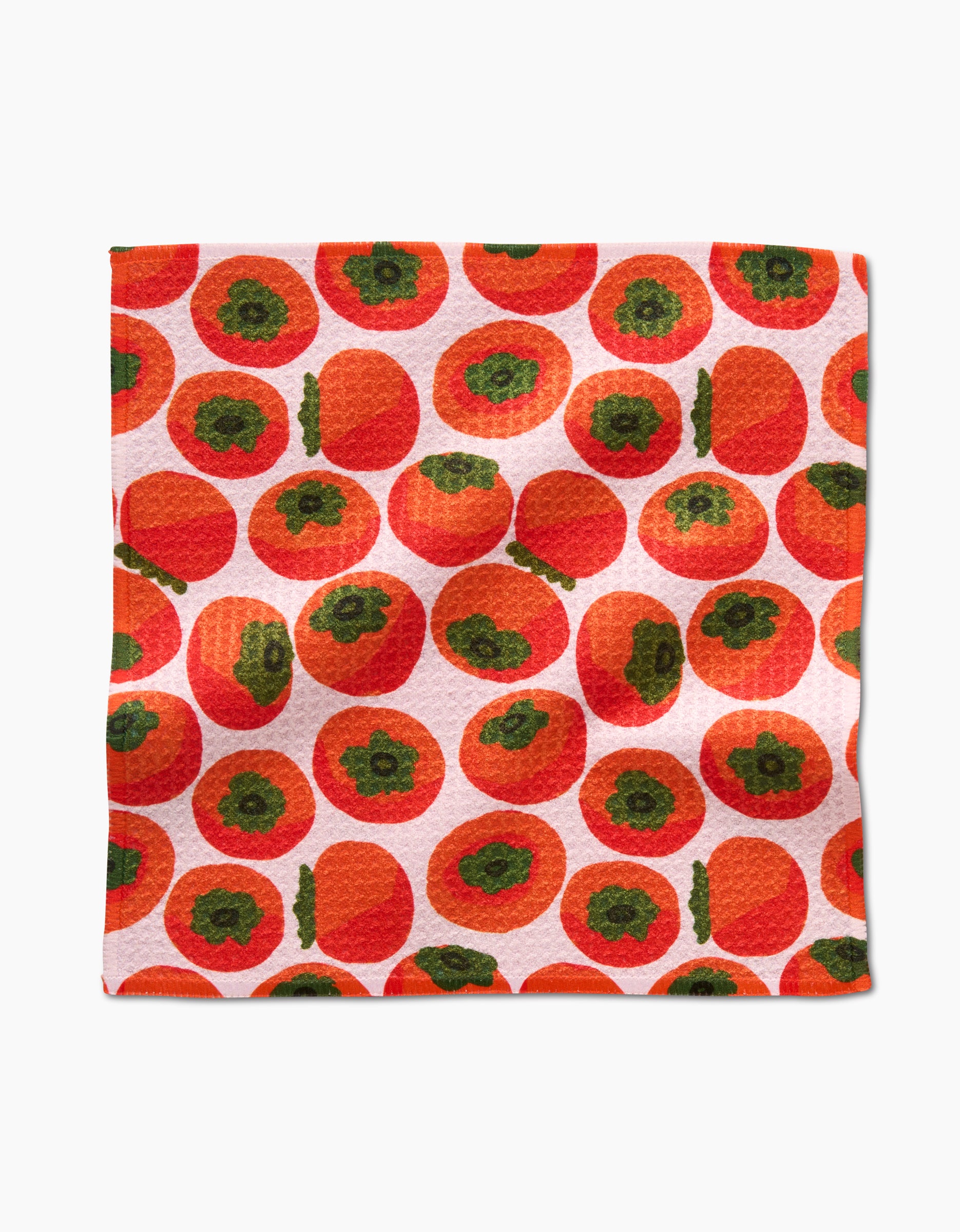 The Persimmons napkin by Katie OShea is made with Geoweave fabric and displays vibrant orange persimmons on a white background. Pair it with our absorbent dishtowels for a colorful, functional kitchen set.