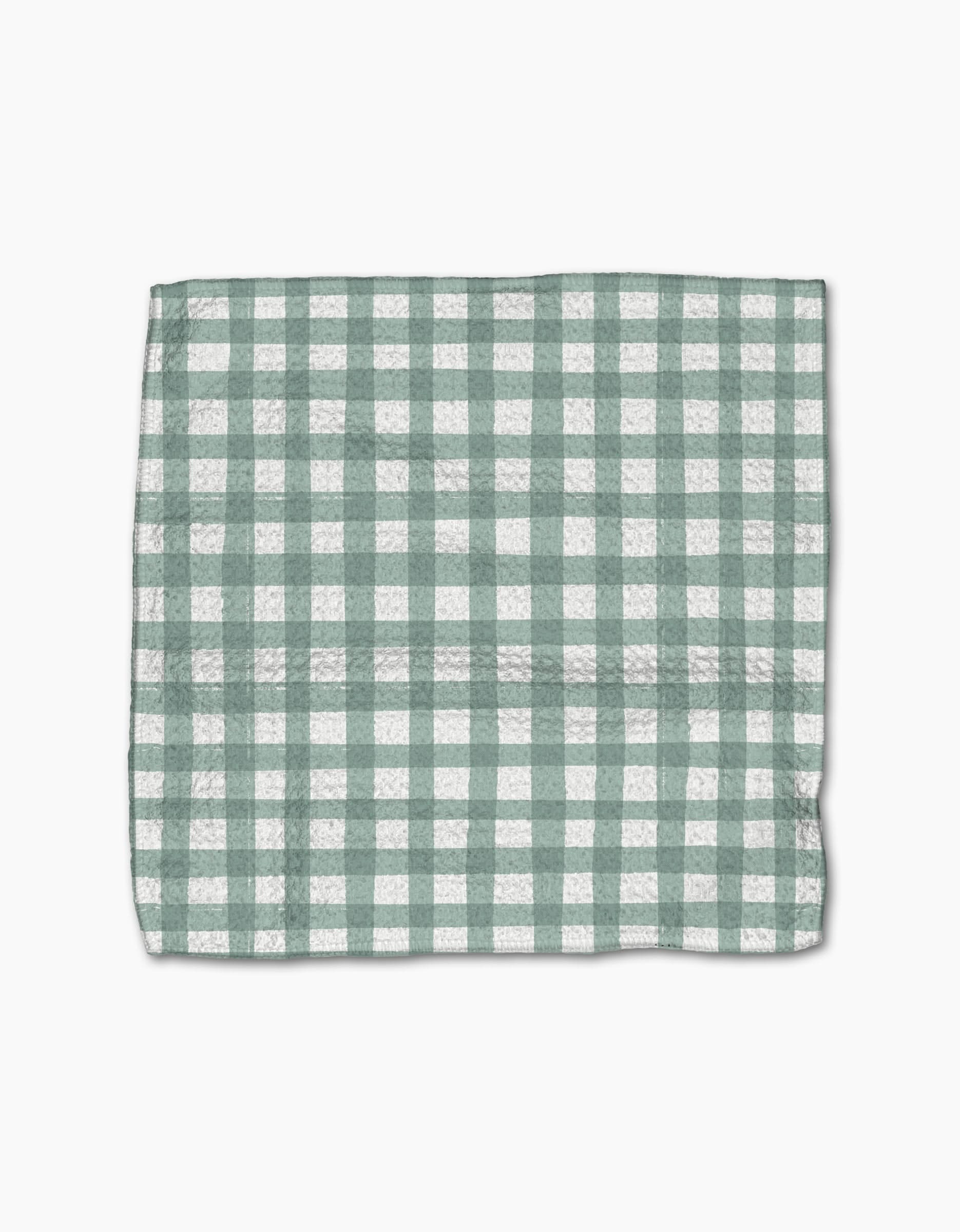 The Picnic Gingham dishcloth by Hufton Studio, featuring a green and white checkered pattern, is laid flat on a white background.
