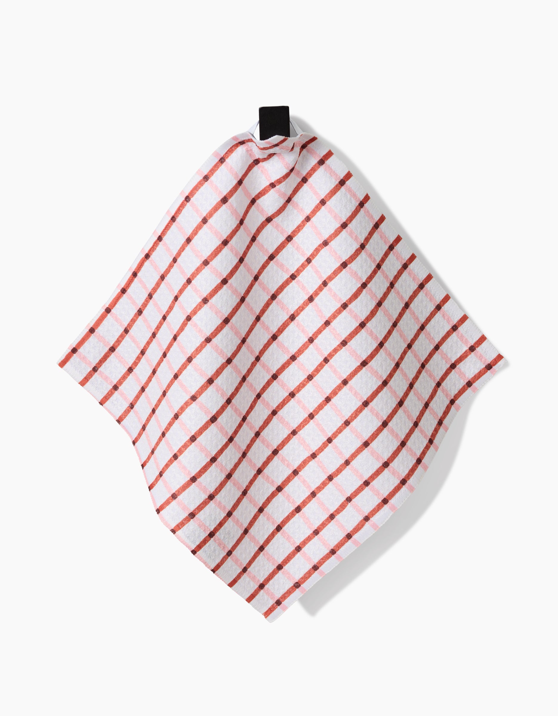 The Playful Retro kitchen towel by Teri the Butter, featuring a red checkered pattern on Geoweave fabric, hangs from a black loop against a plain white background.