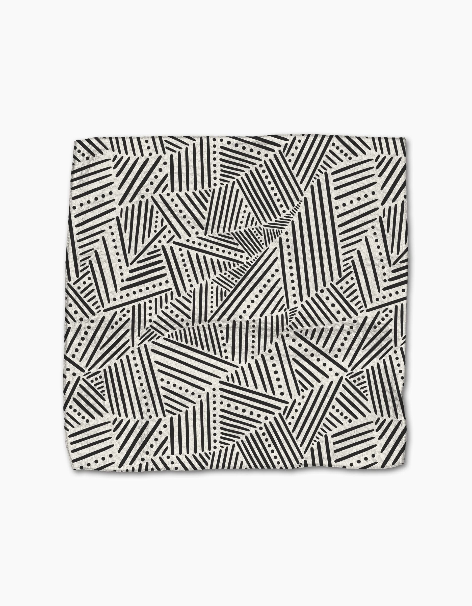 The Rhythm Current Stripes dishtowel by Sarah Daugherty features a folded, super-absorbent design with black and white geometric diagonal stripes, triangles, and dotted lines on a light background.