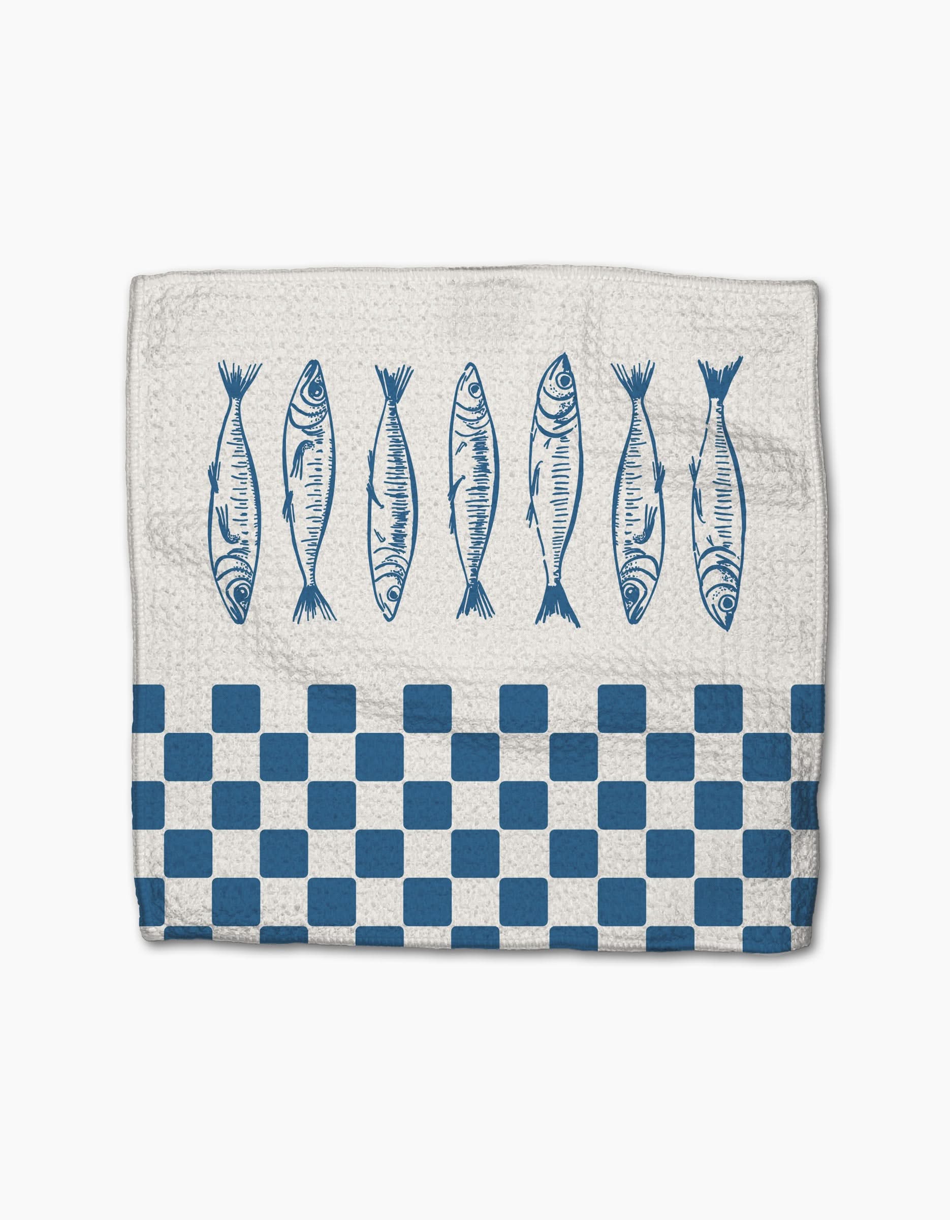 The Hufton Studio Sardine Check Blue napkin is a white Geoweave cloth featuring six blue fish illustrations above a blue and white checkered border along the bottom edge.
