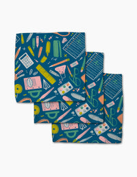 School Days by Amy MacCready: Set of three blue recycled napkins featuring playful, colorful school supplies in a scattered pattern—rulers, calculators, test tubes, scissors, erasers, and more. A cheerful dishcloth set for any home.