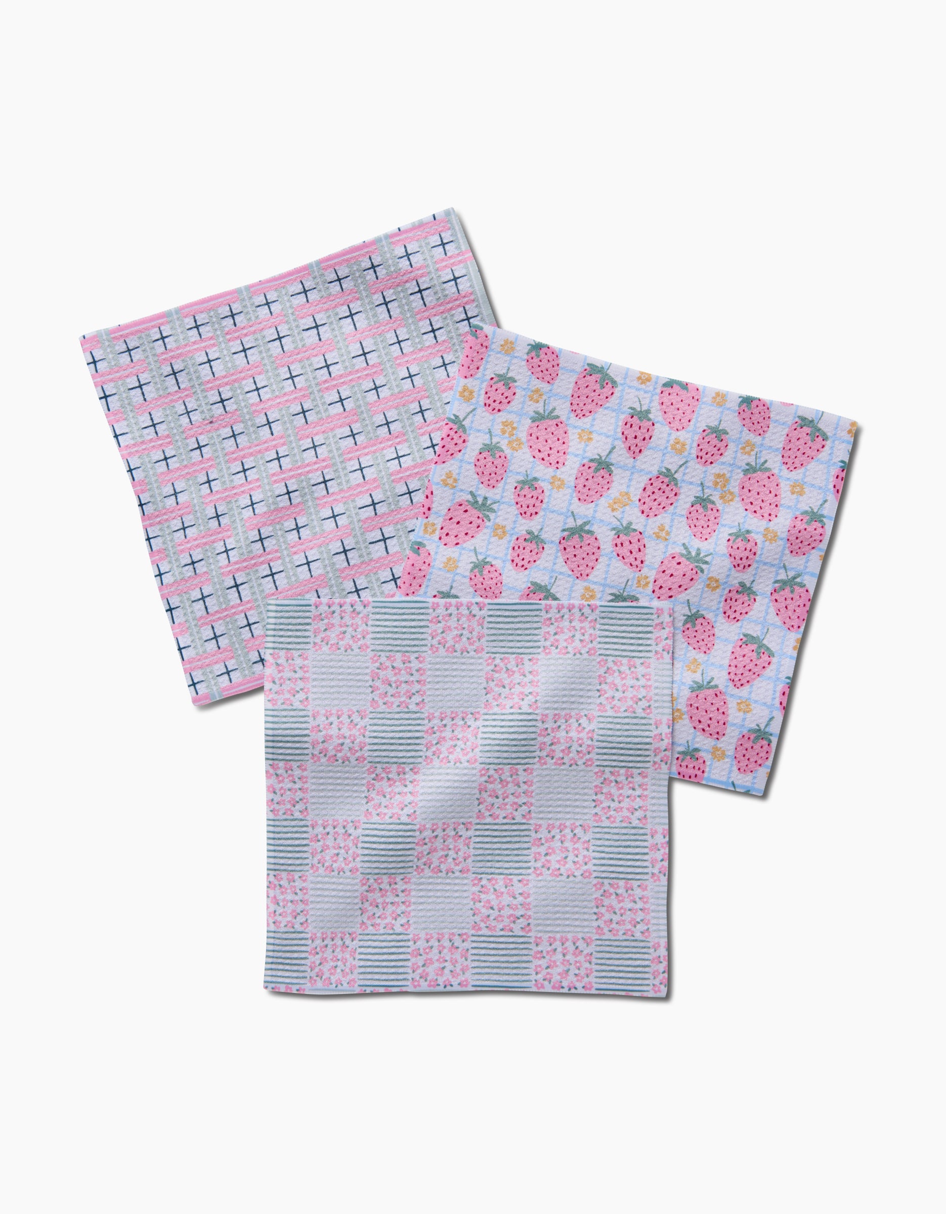 The Spring Picnic Day Dishcloth Set from Hufton Studio includes three super-absorbent Geoweave cloths in pastel check, strawberry, and floral striped patterns—adding soft color and style to your kitchen.