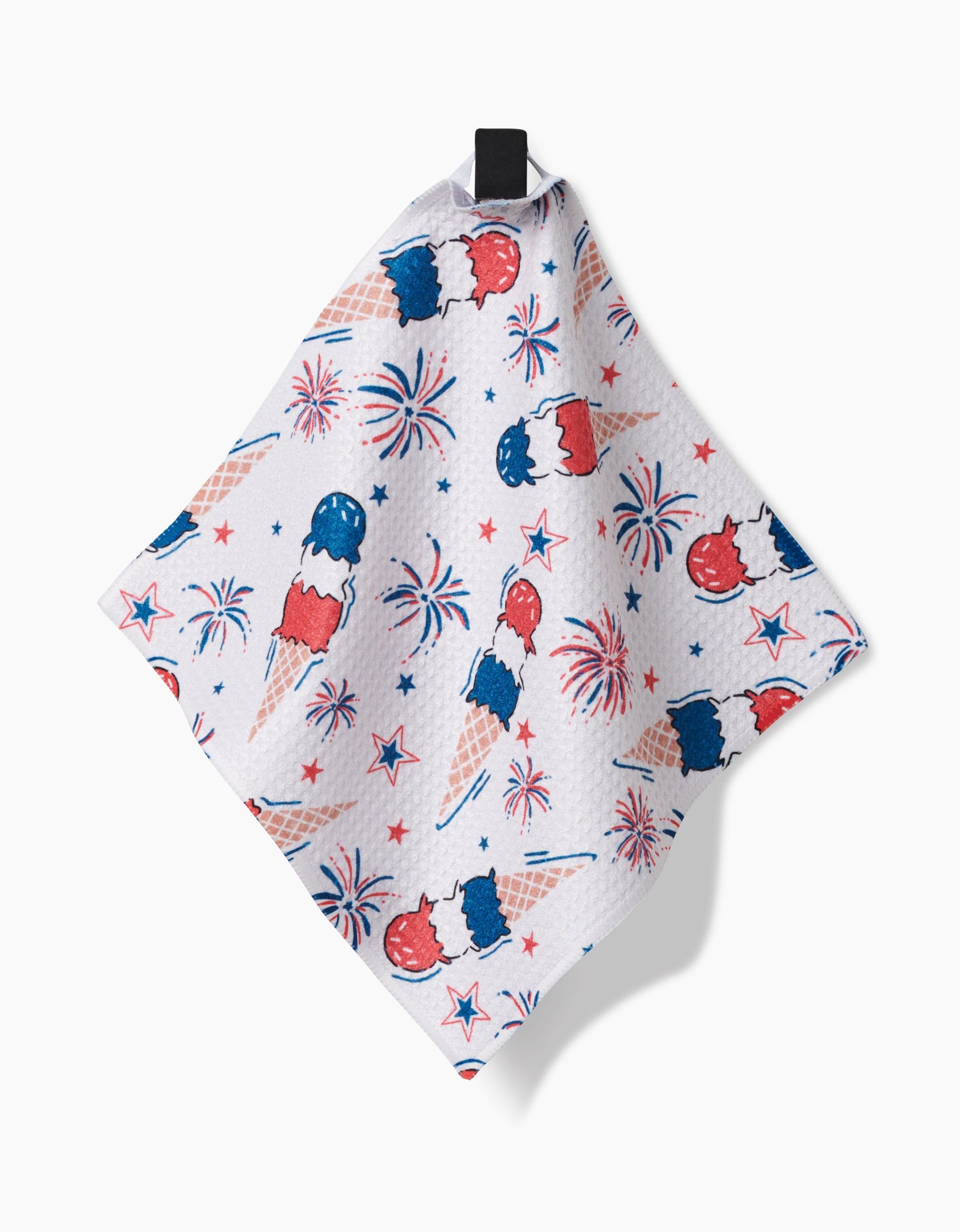 The Stars In Your Eyes Geoweave cloth by Hufton Studio displays a festive red, white, and blue ice cream cone, stars, and fireworks pattern. It hangs by a black loop against a white background.