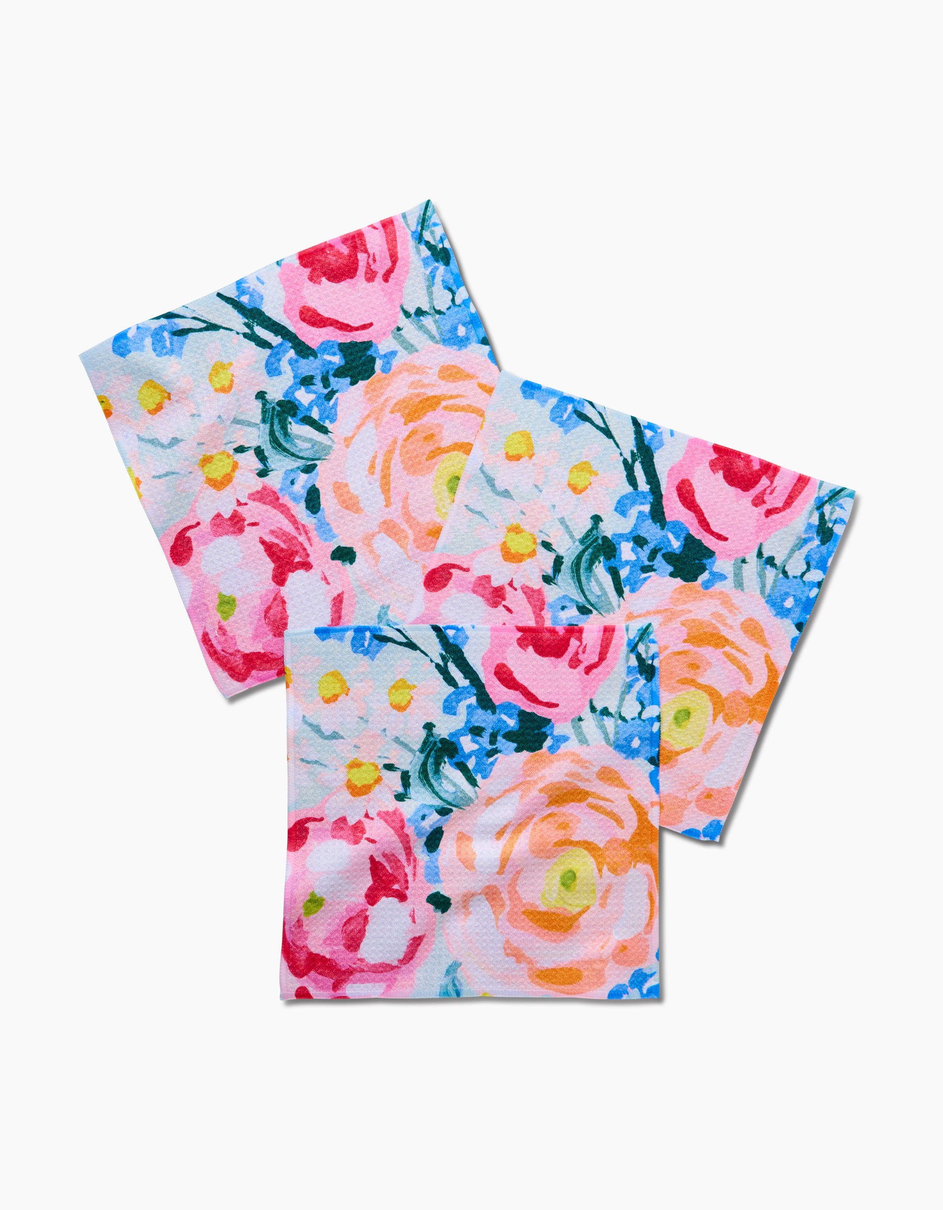 Set of three Suzzy square napkins by Ania Zwara Art, featuring a vibrant floral pattern with pink, peach, and red flowers plus green and blue accents on white—great for pairing with a recycled-material dishcloth.